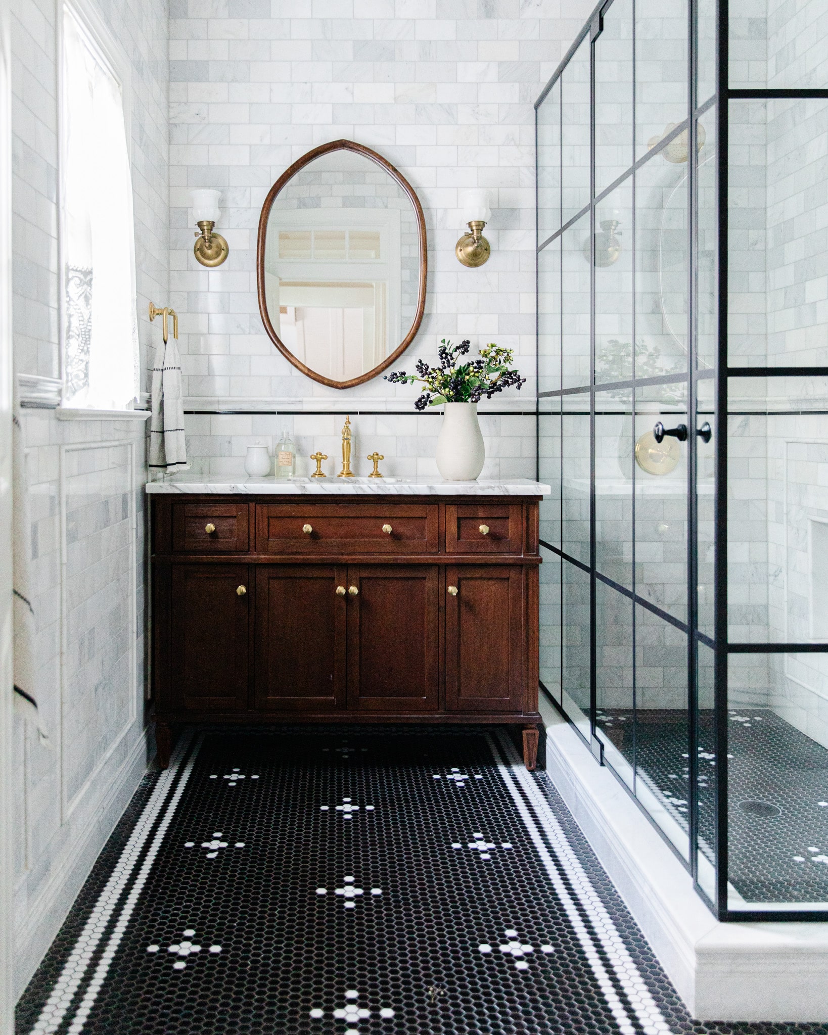 Greta's Bathroom Renovation Reveal: Moody Marble Tile, Warm Wood Vanity & Black Grid Shower - Chris Loves Julia