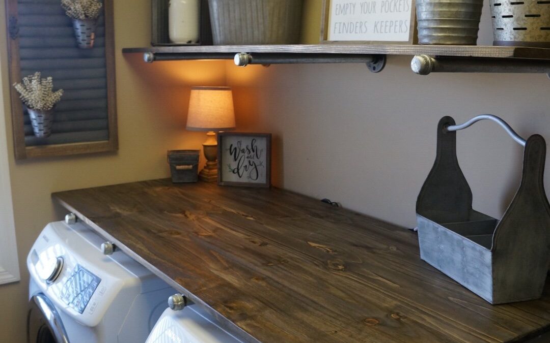 Laundry Room DIY makeover after picture farmhouse decor rustic wood shelves with industrial pipe - Wilshire Collections