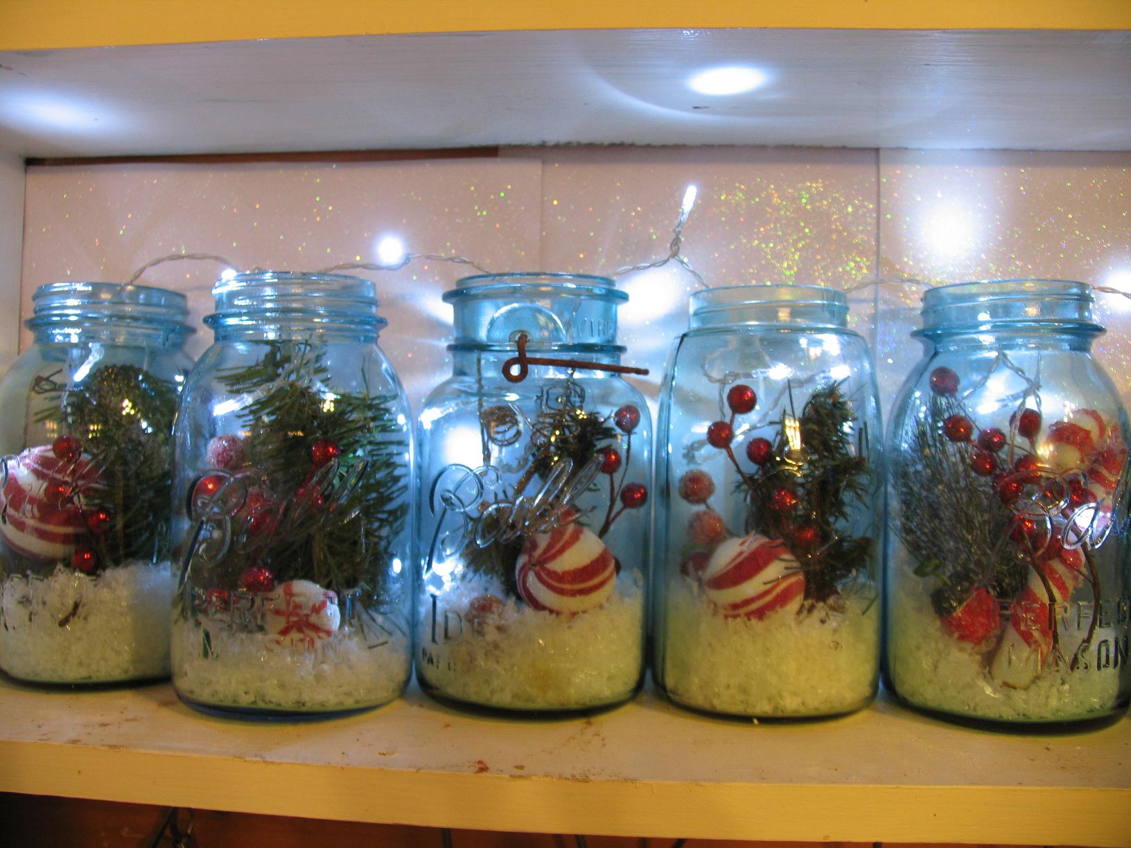Mason jars filled with Christmas picks,snow, and lights for holiday cheer!