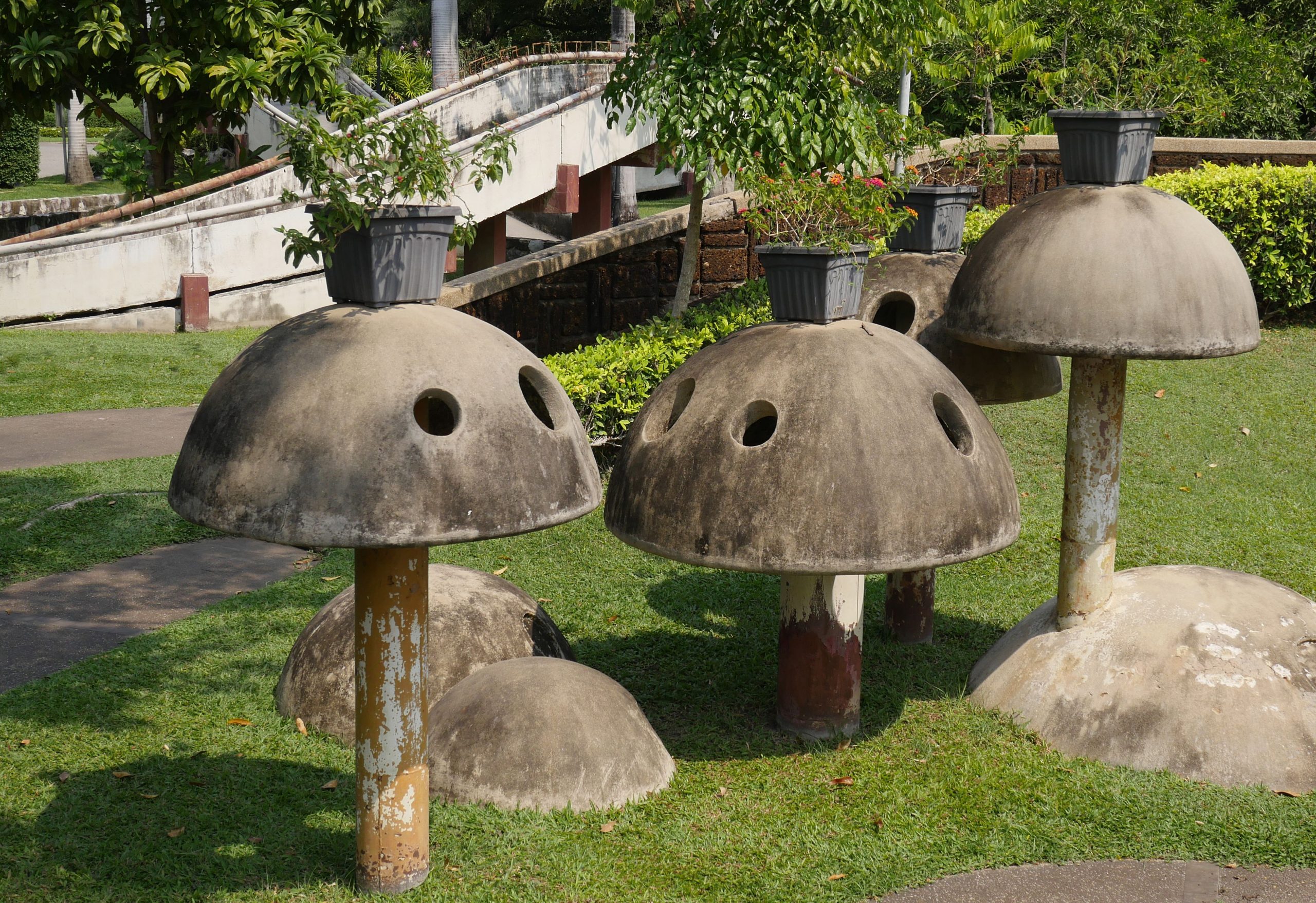 Mushroom-shaped concrete structures in a scenic park in Bangkok, Thailand.