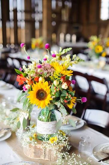 Pink and Yellow Centerpieces in Mason Jars on Burlap Table Runners