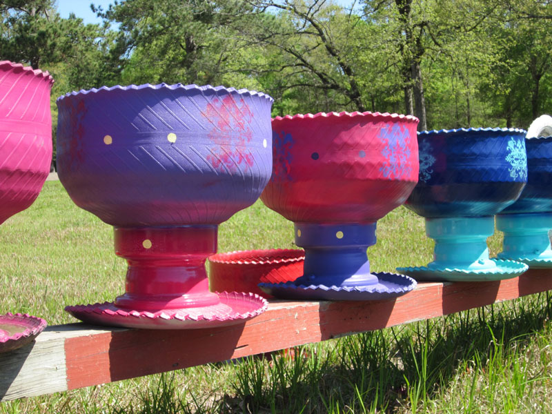 Tire planters – on the roll in gardens – by Diane Morey Sitton - Neil Sperry's GARDENS