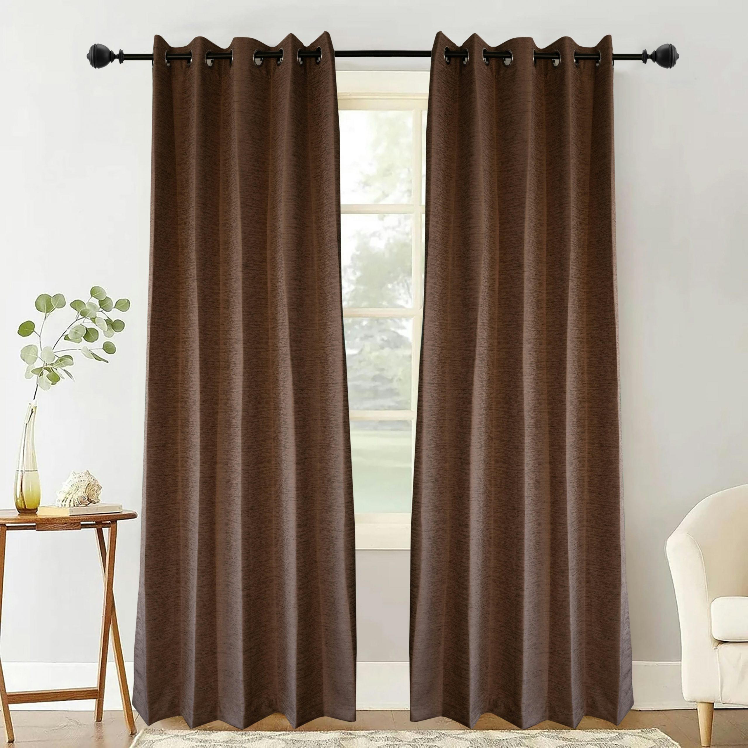 Two dark brown curtains hang on a window.