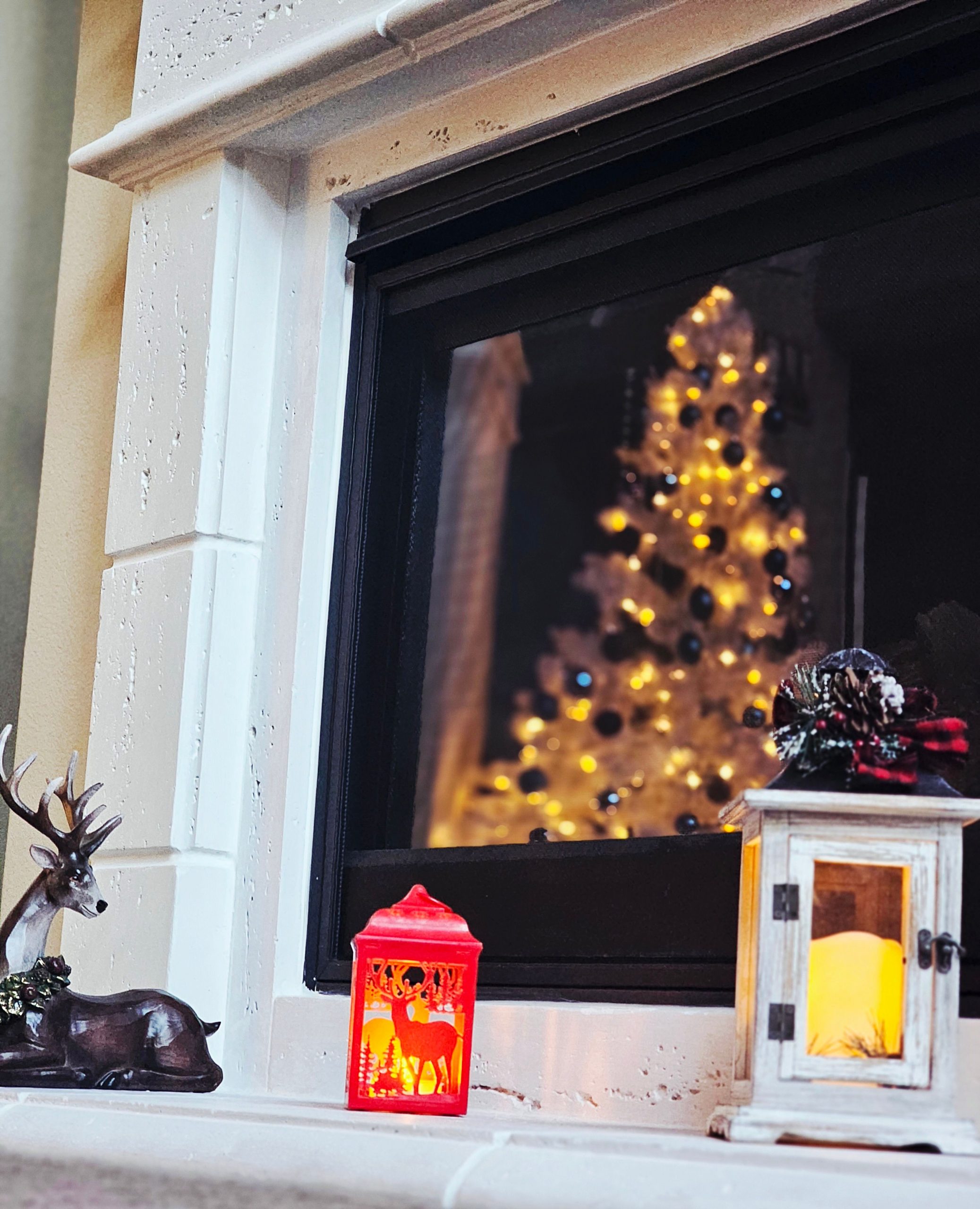 Warm holiday scene with festive decor reflecting on a fireplace. Ideal for Christmas themes.