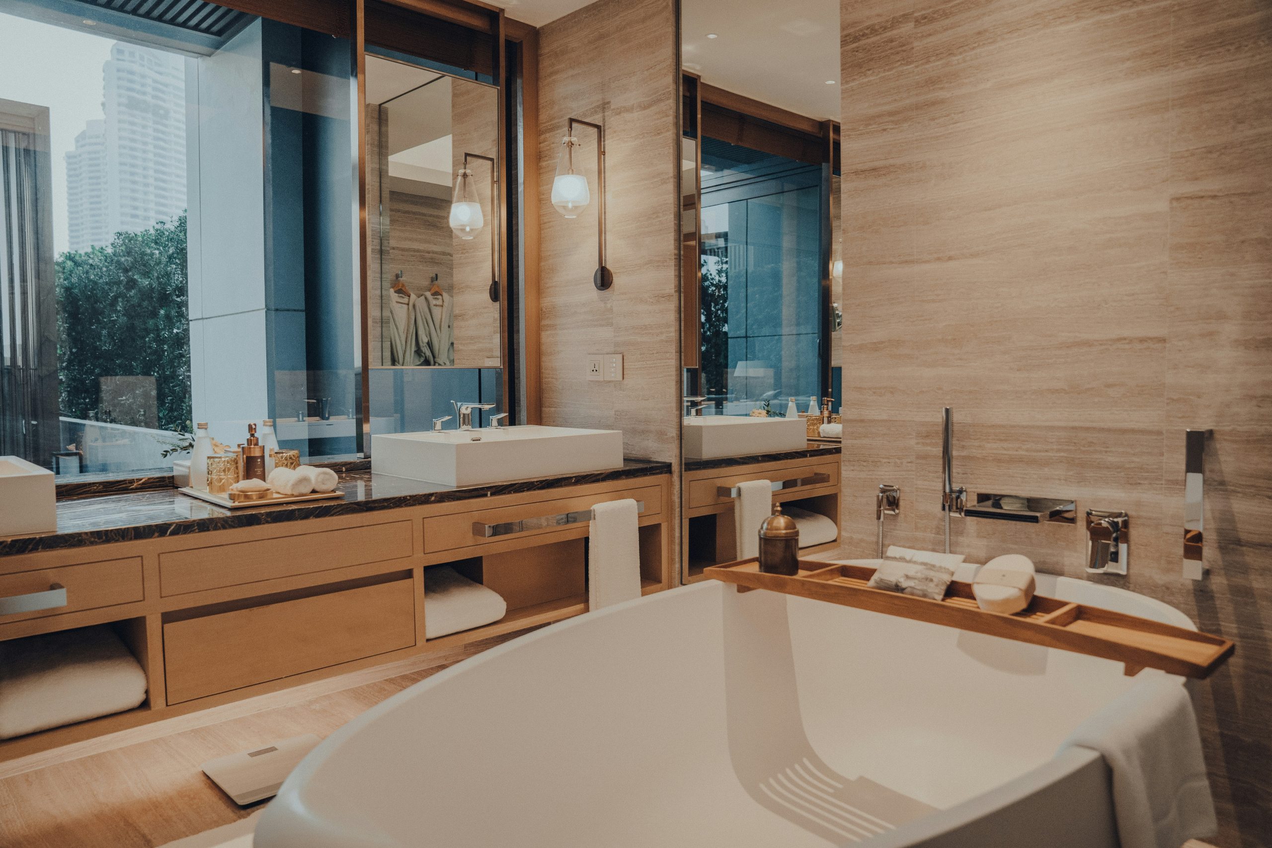 a bathroom with a large bathtub next to a window