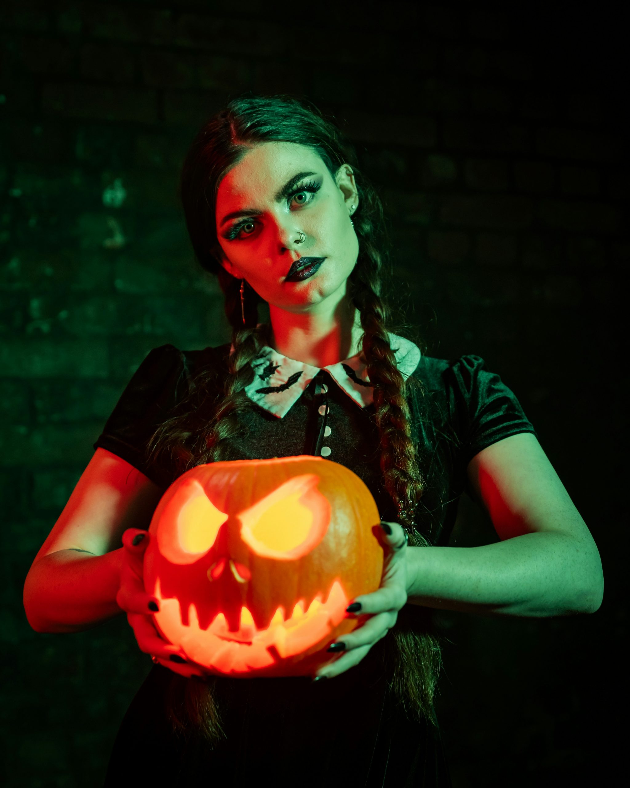 a person holding a pumpkin