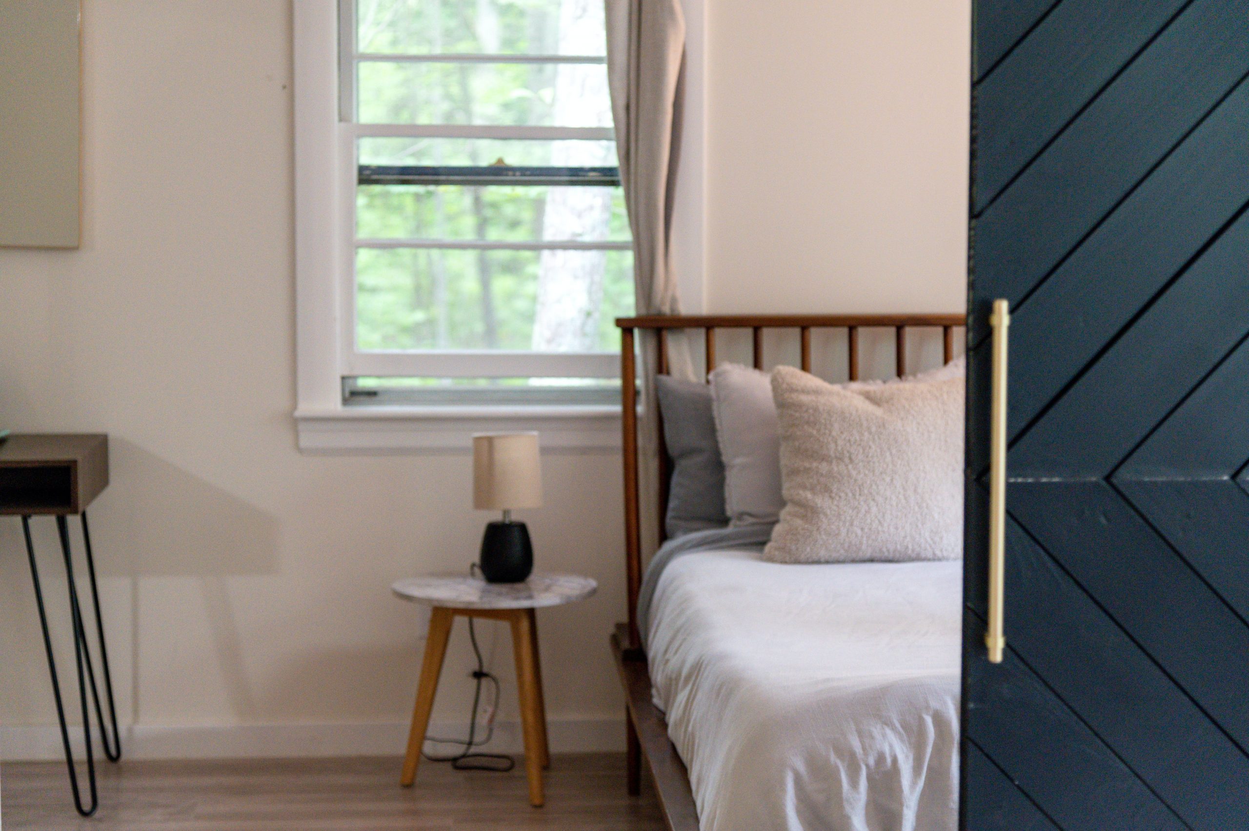A serene and cozy bedroom interior featuring a comfortable bed and soft lighting, perfect for relaxation.