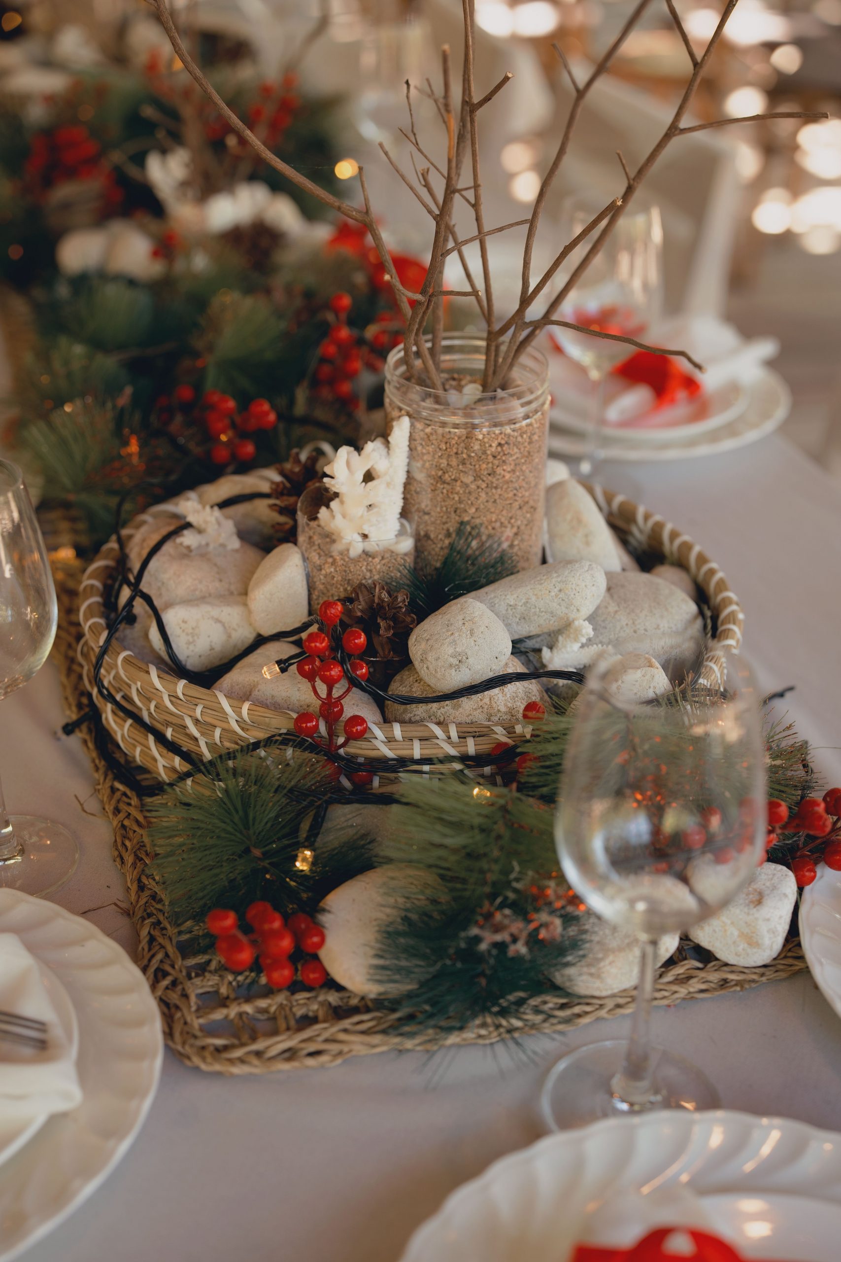 Beautiful rustic table centerpiece with natural elements and festive decorations.