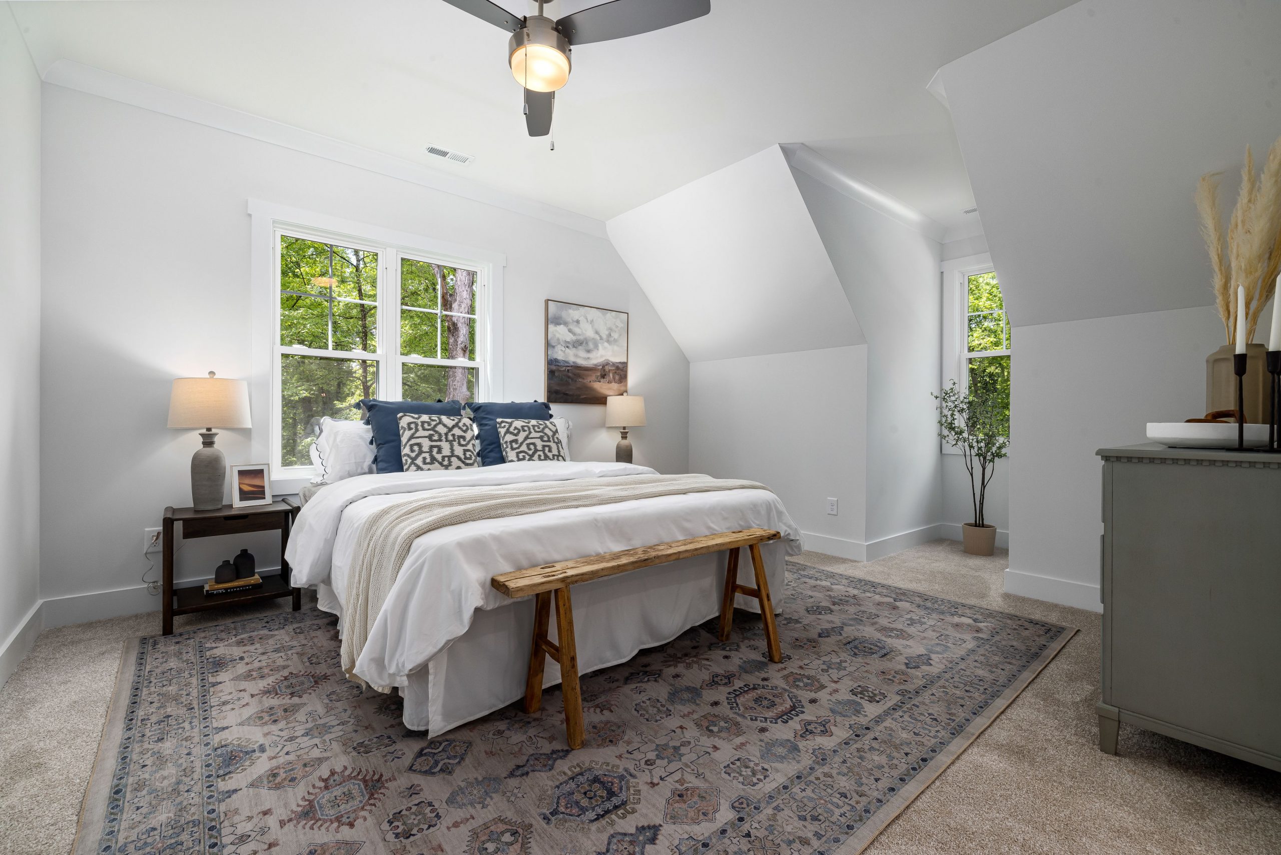 Bright and cozy modern bedroom featuring minimalist decor, neutral tones, and natural lighting.