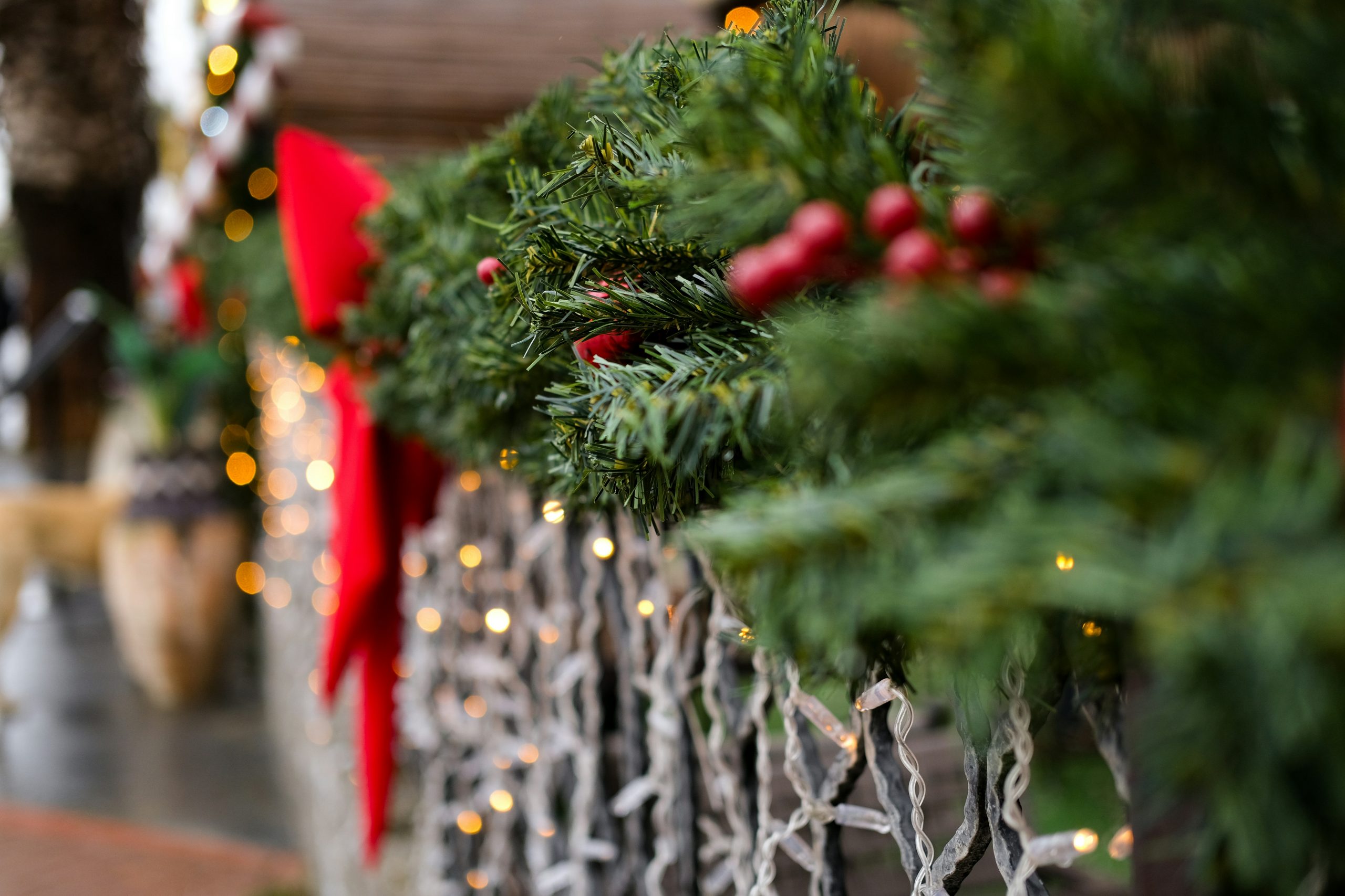 Christmas garland with red bows and lights