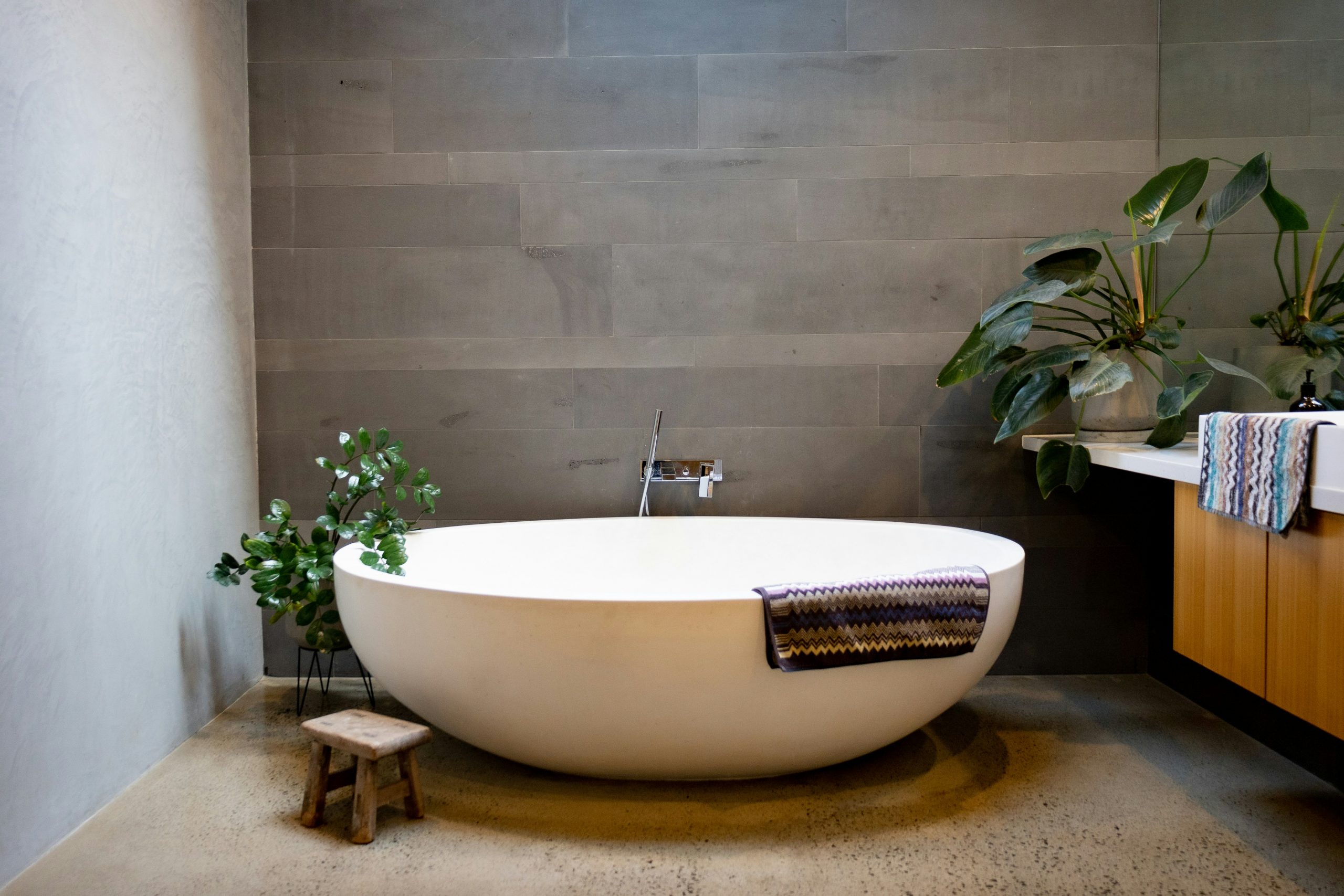 Contempery bathroom, freestanding bath, interior design, stone flooring