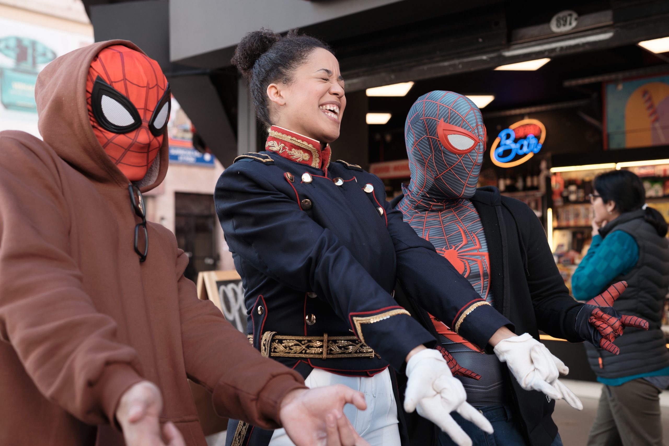 Cosplayers in a street market in Buenos Aires wearing themed costumes and enjoying the lively urban atmosphere.
