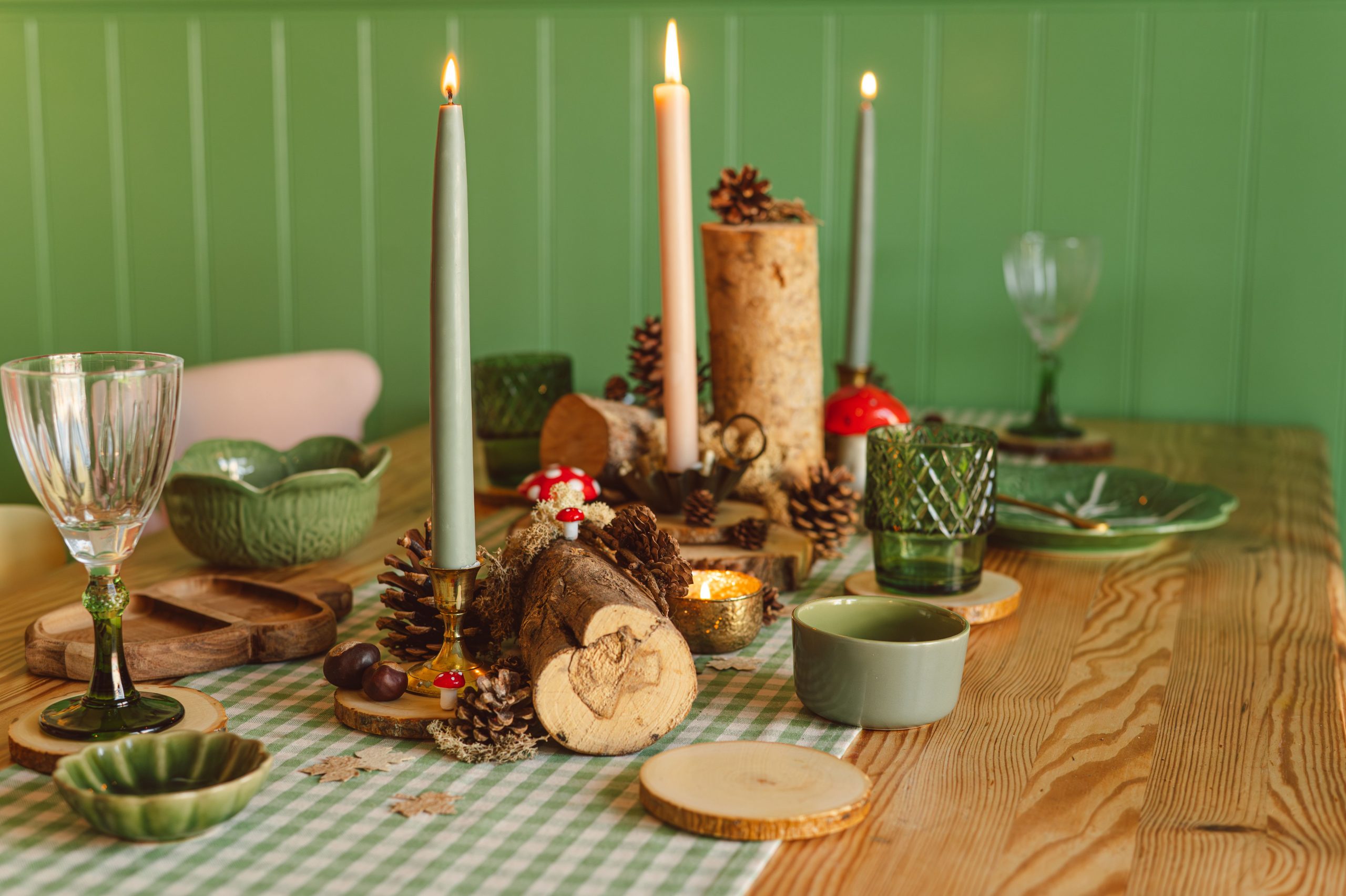 Discover a cozy woodland-inspired autumn tablescape with candles and natural elements.