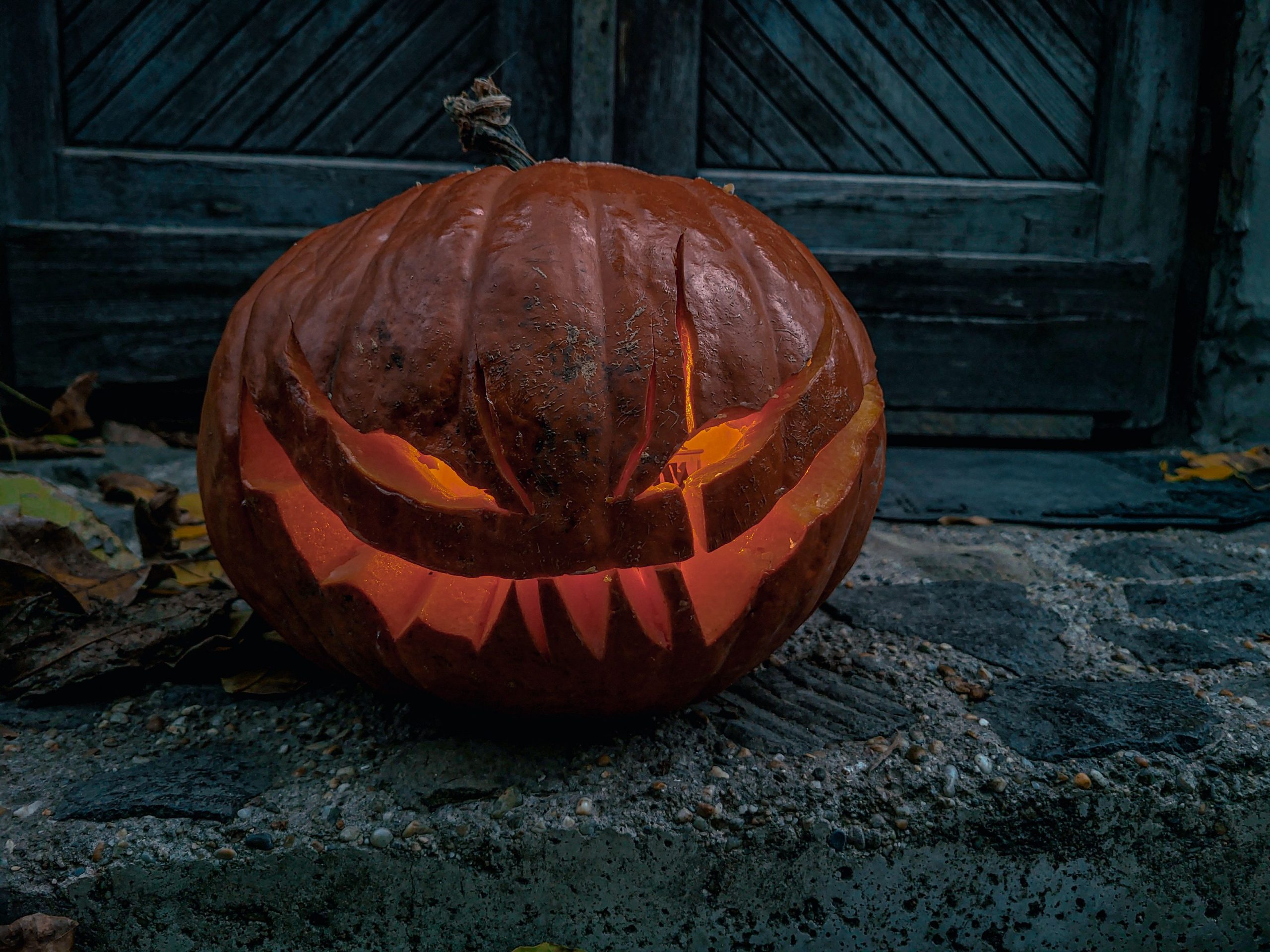 Eerie jack-o'-lantern glowing in the dark, perfect for Halloween ambiance.