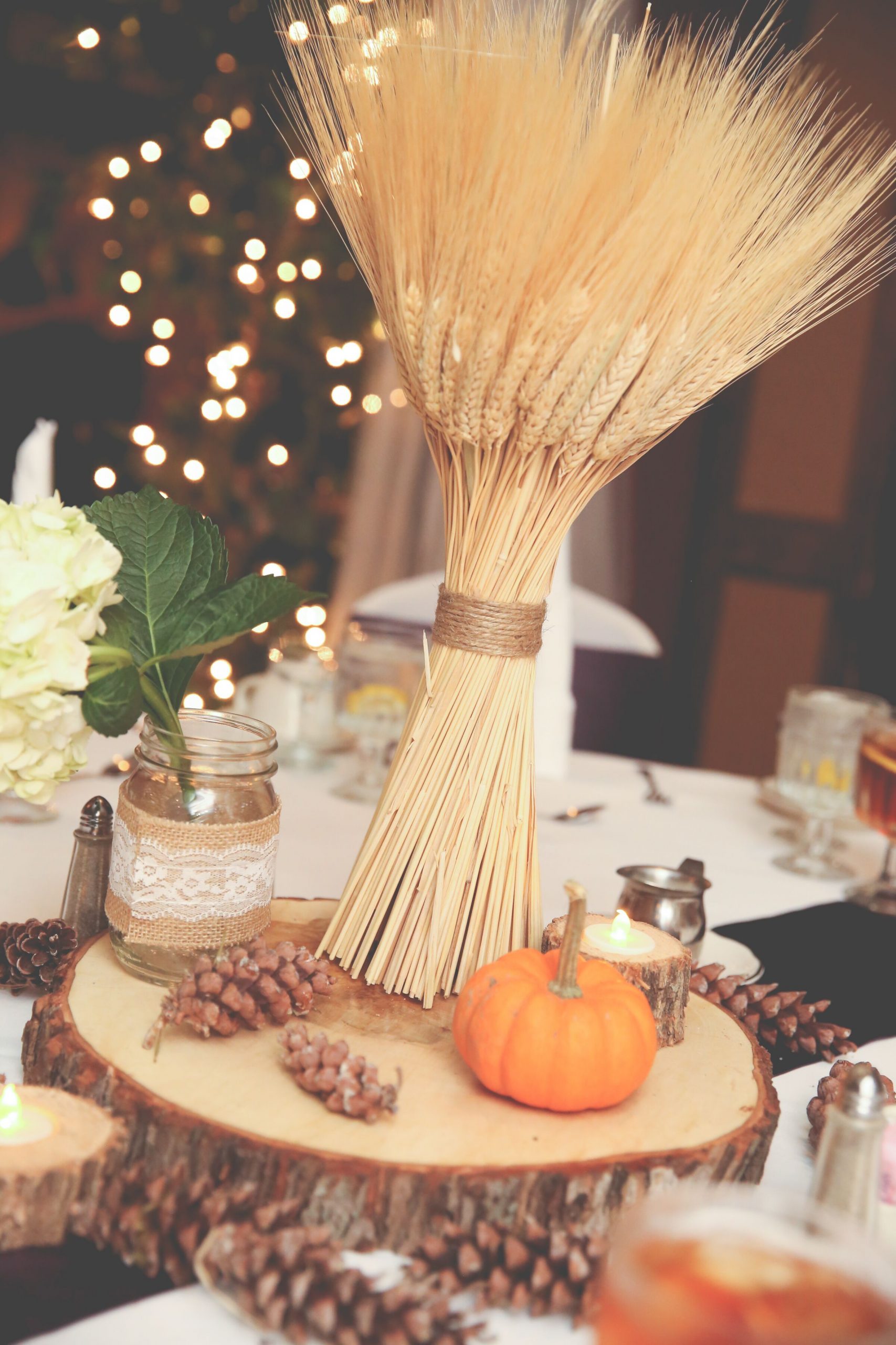 Fall-Inspired Wheat, Pumpkin and Pine Cone Centerpieces