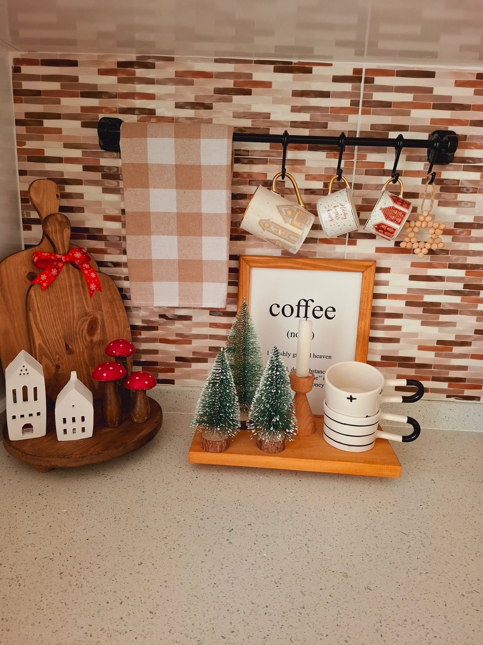 Festive kitchen corner with mugs, holiday decorations, and cozy elements.