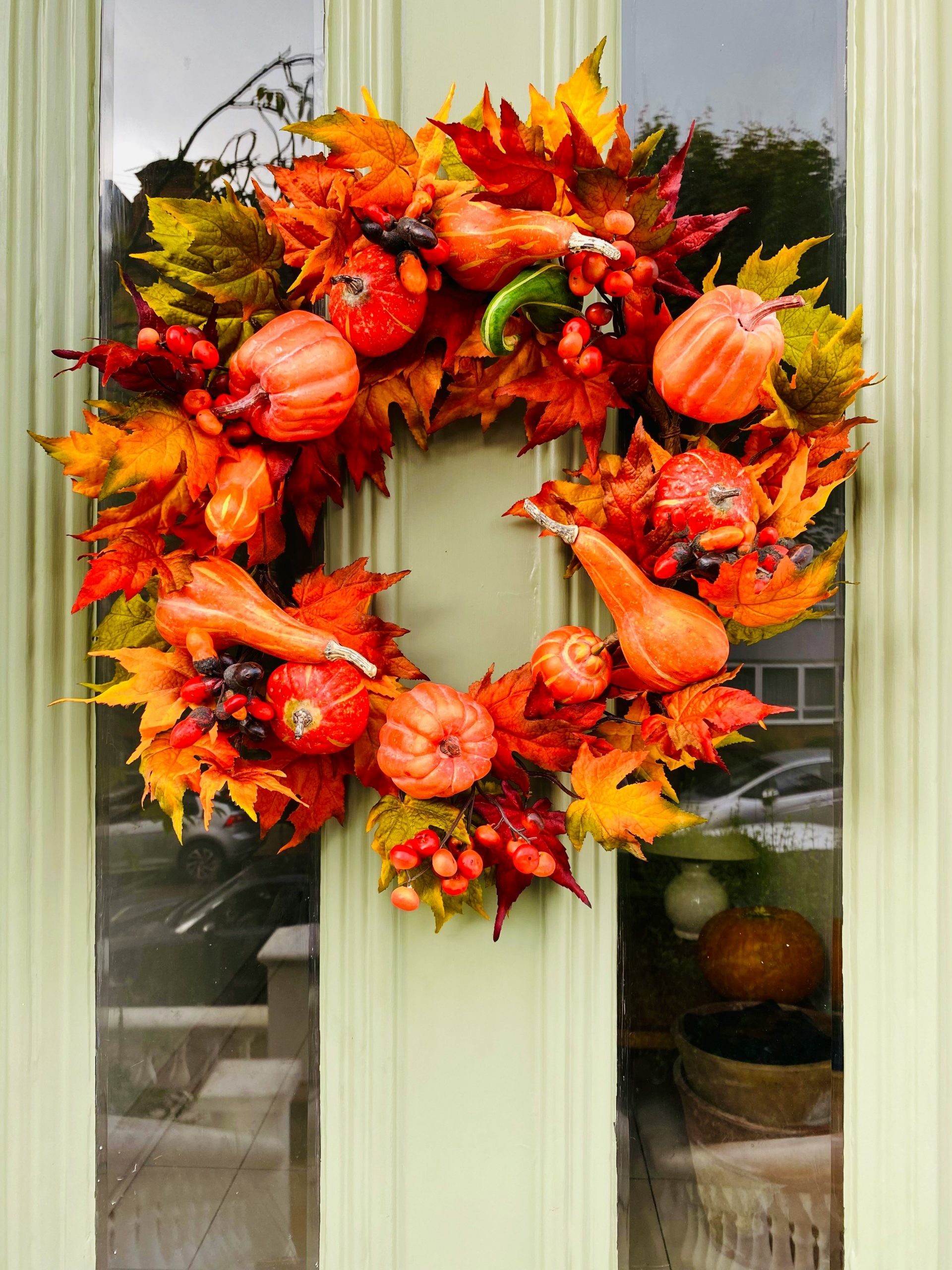 halloween decorations - autumn vibes, pumpkin and maple leaf wreath on mint green door - earth tones, orange aesthetic, or aesthetically orange? but it ain't the car from a couple of pictures back