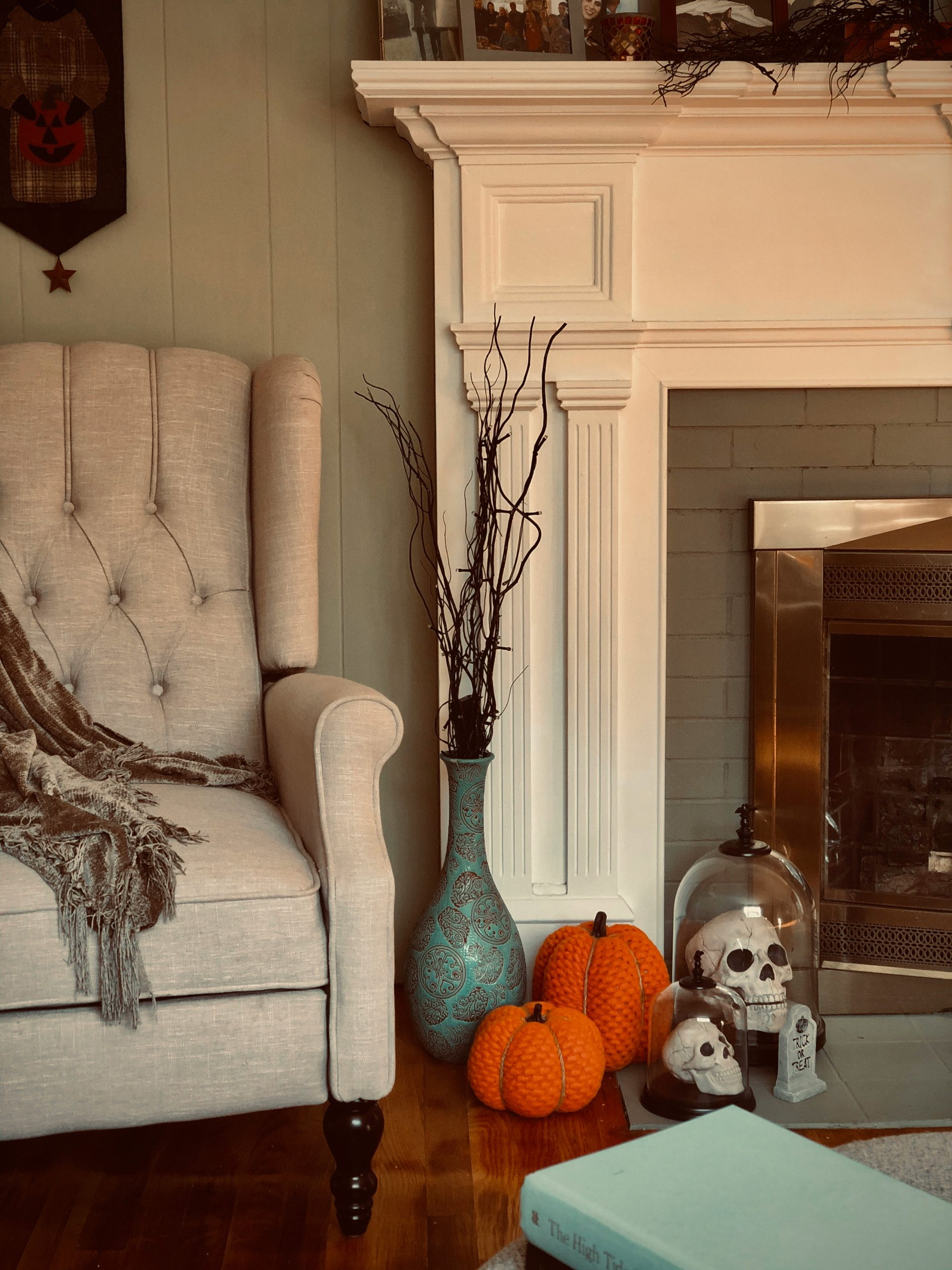 Halloween home decor in front of a cozy fireplace!
