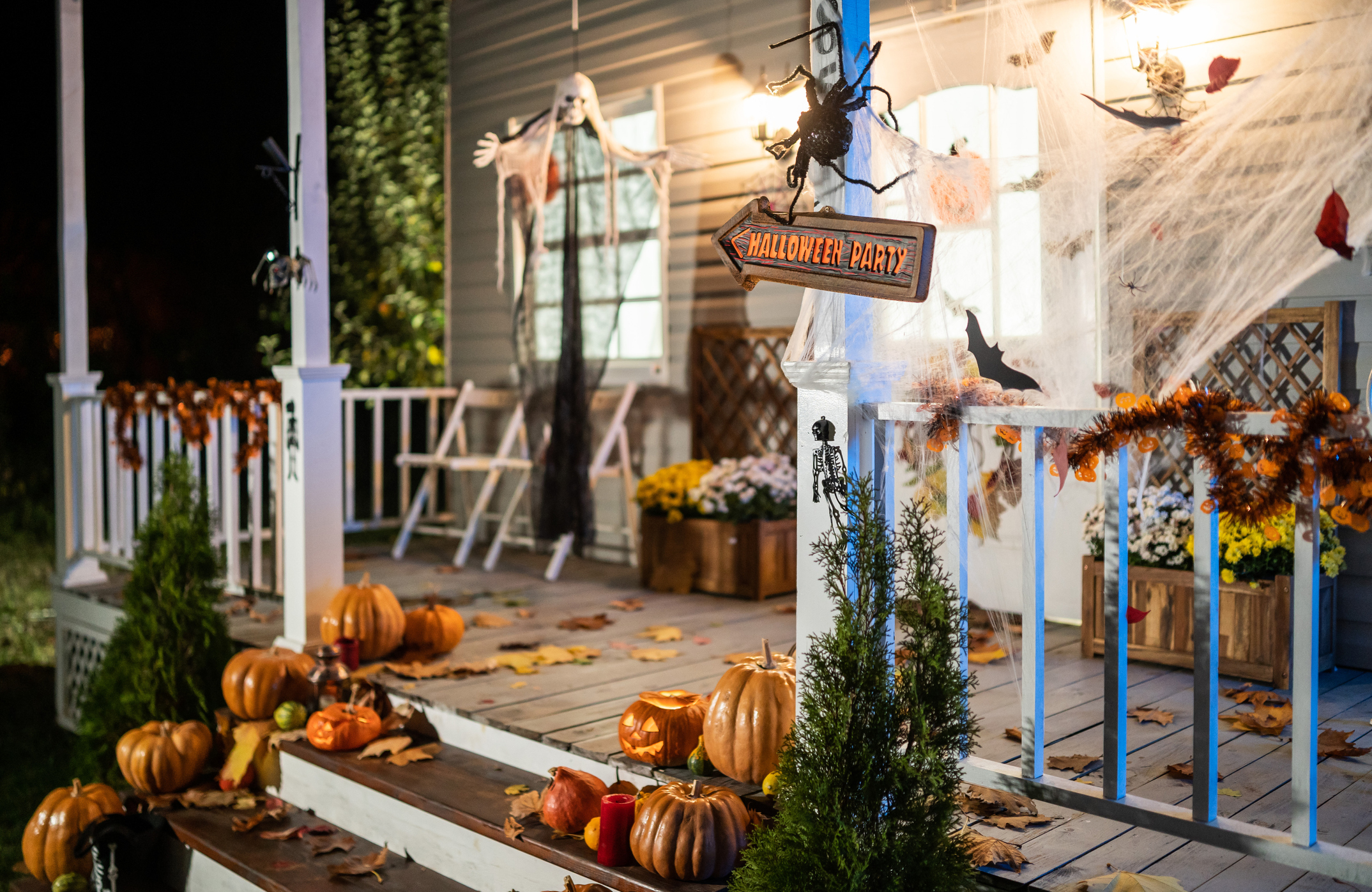 Halloween Jack-o-Lantern Pumpkins on a porch stairs | Blain's Farm & Fleet