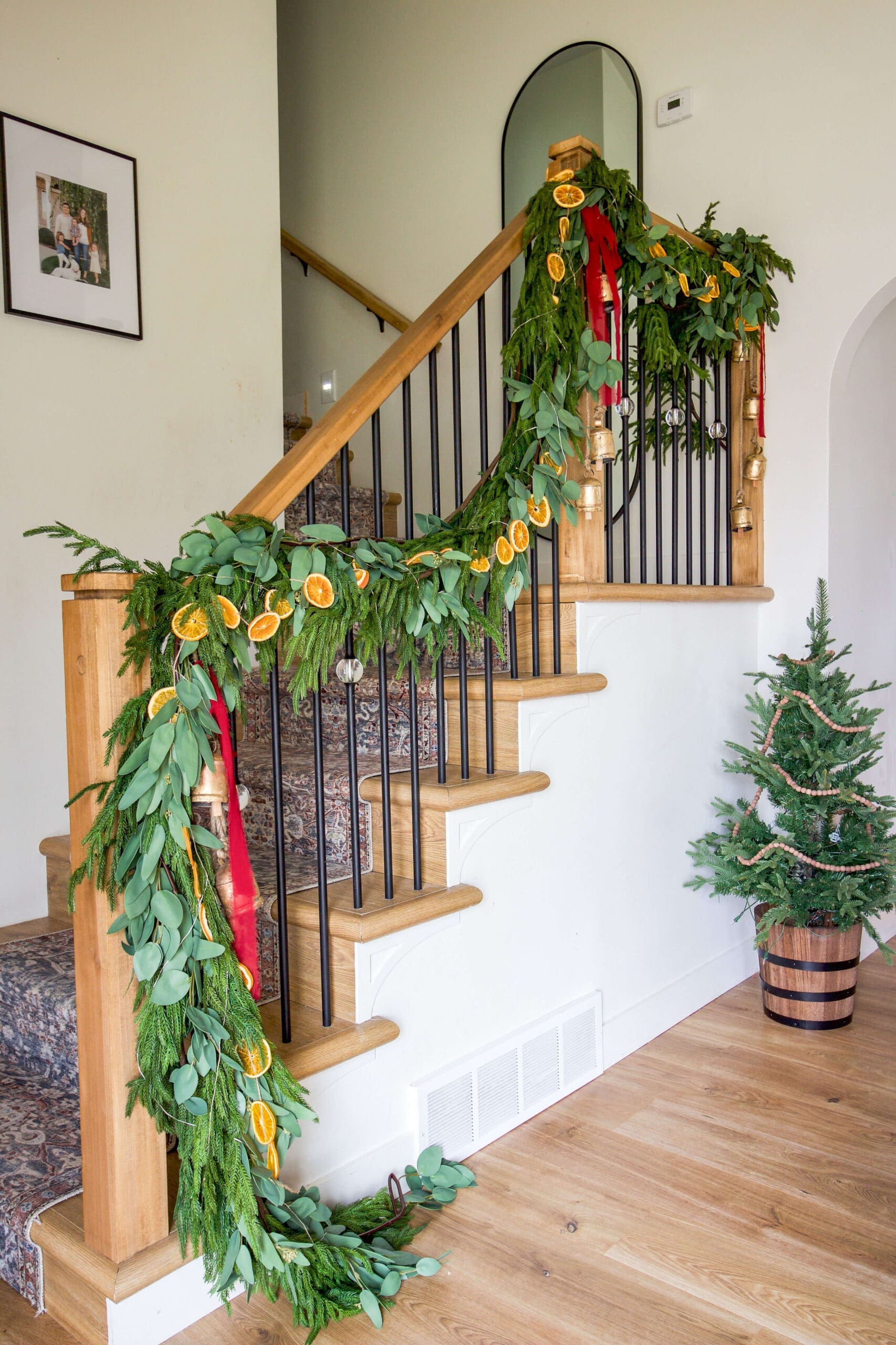 How to Decorate With Christmas Garland on a Staircase | Crystel Montenegro Home