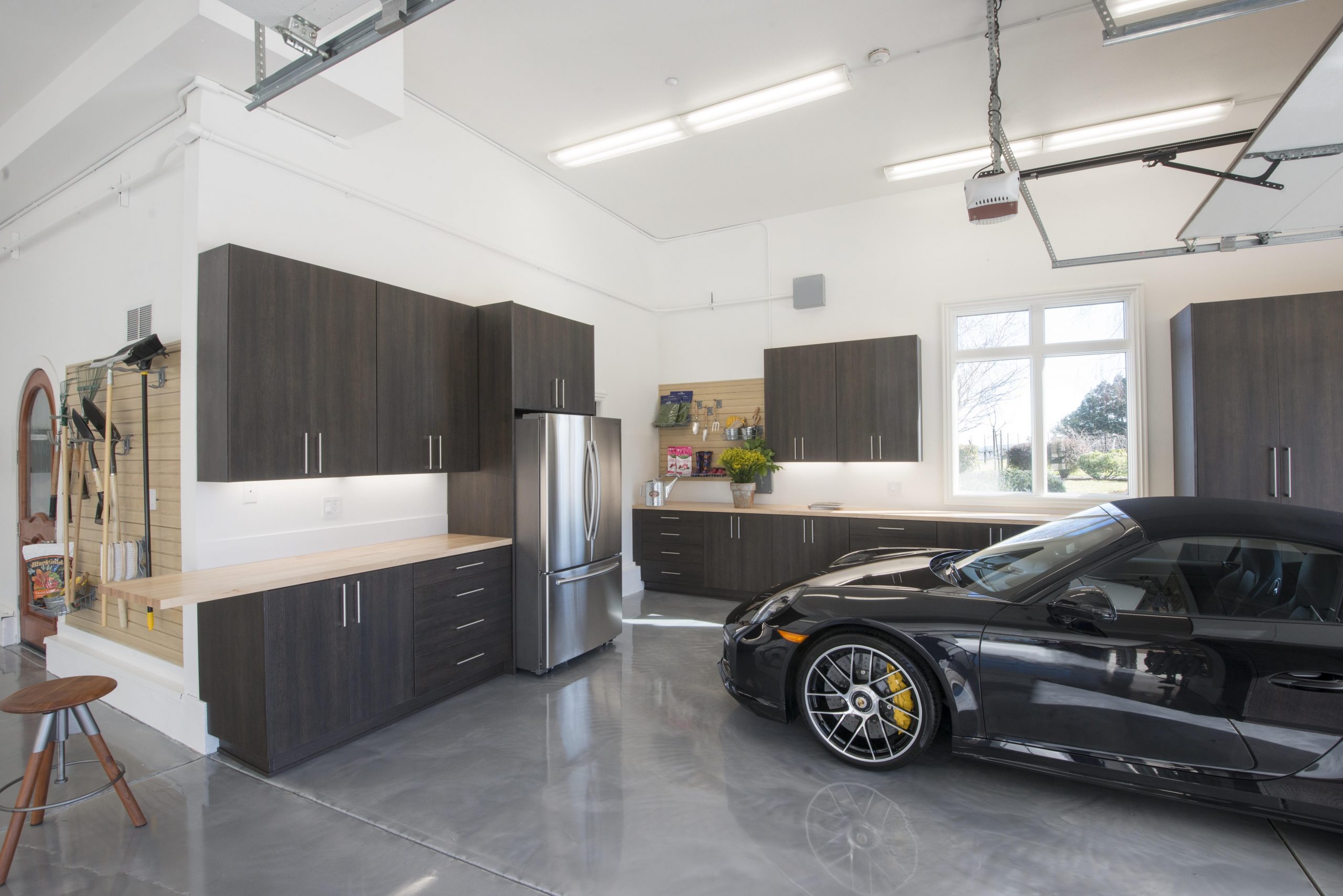 Modern garage design features a kitchen and clever storage | Woodworking Network