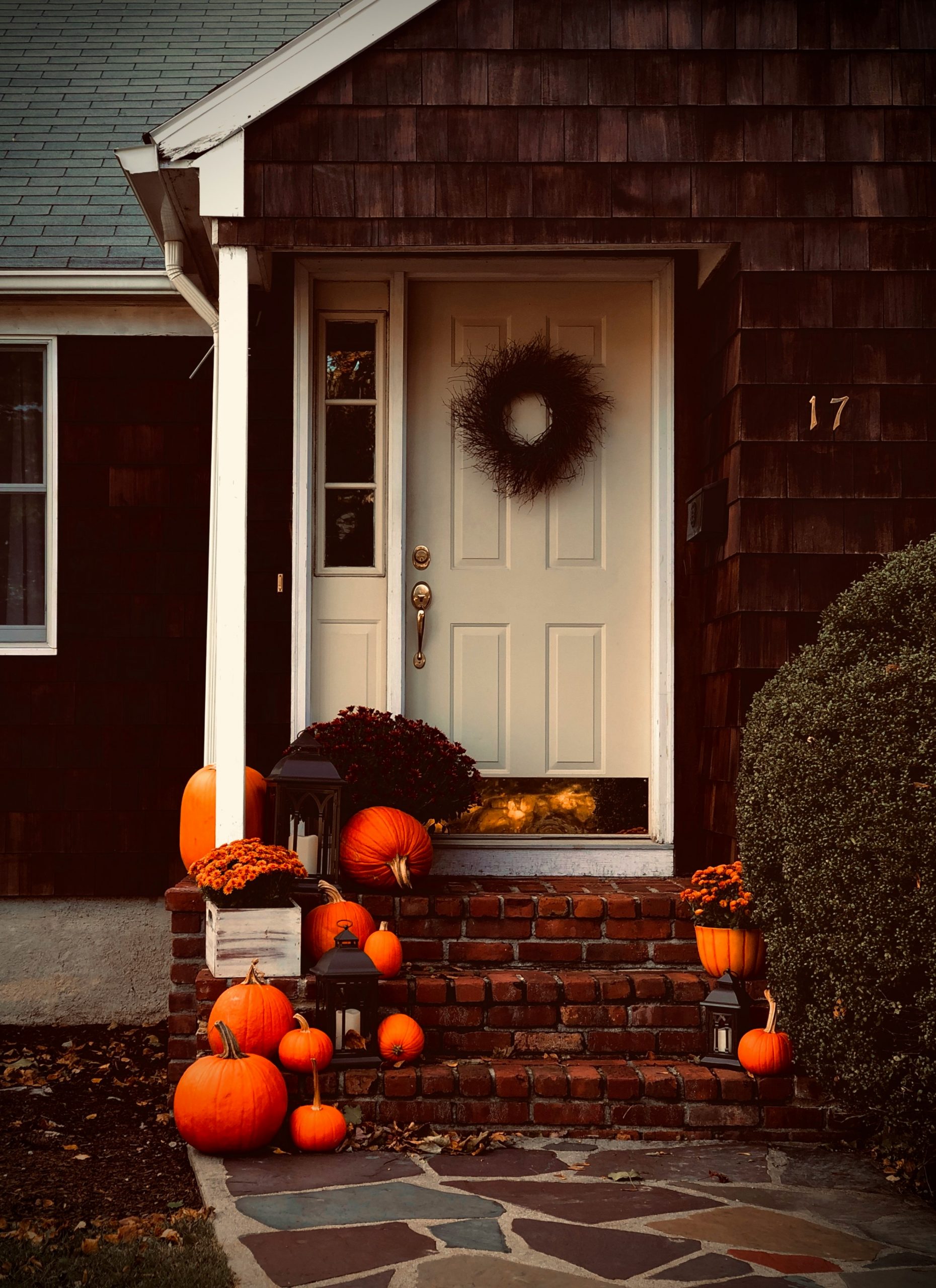 Our front porch, decorated with lanterns, pumpkins and colorful mums for the fall season. Rhode Island, USA -- homes and decor like this are very common in New England/Northeastern United States