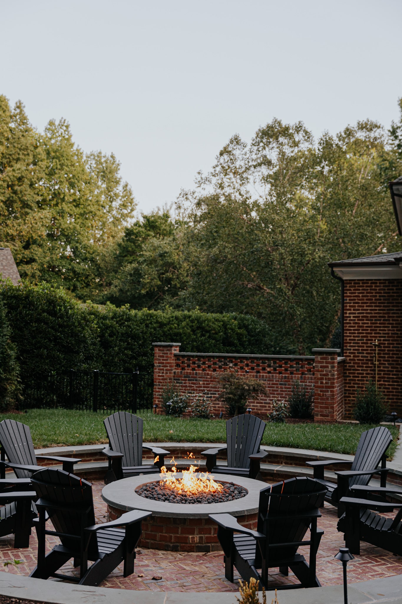 Our Sunken Fire Pit Paired With Black Adirondack Chairs