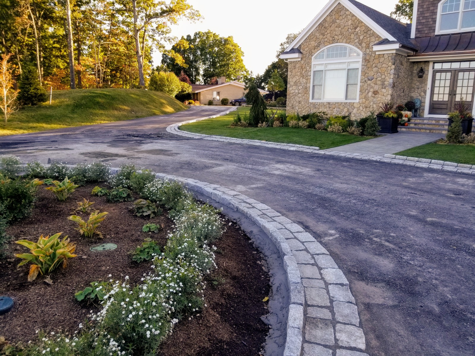 Cobblestone Driveway Aprons and Border Completed in Hudson, MA - Down East Landscape