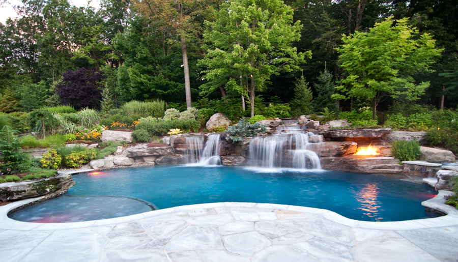 custom-volcanic-fire-pit-luxury-swimming-pool-waterfall-ideas-nj | Cipriano Landscape Design and Custom Swimming Pools