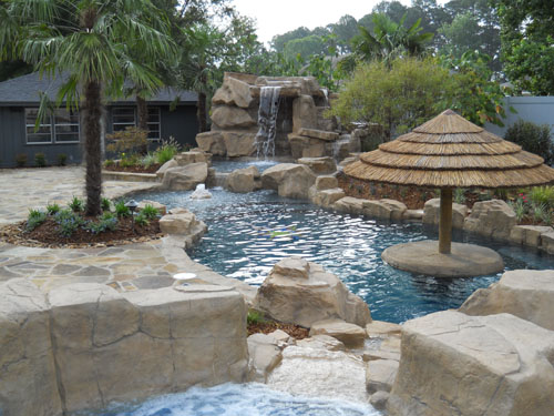 GROTTO WITH WATERFALL ENHANCES MINT SWIMMING POOL - Poolandspa.com Online Newsletter Article 2011