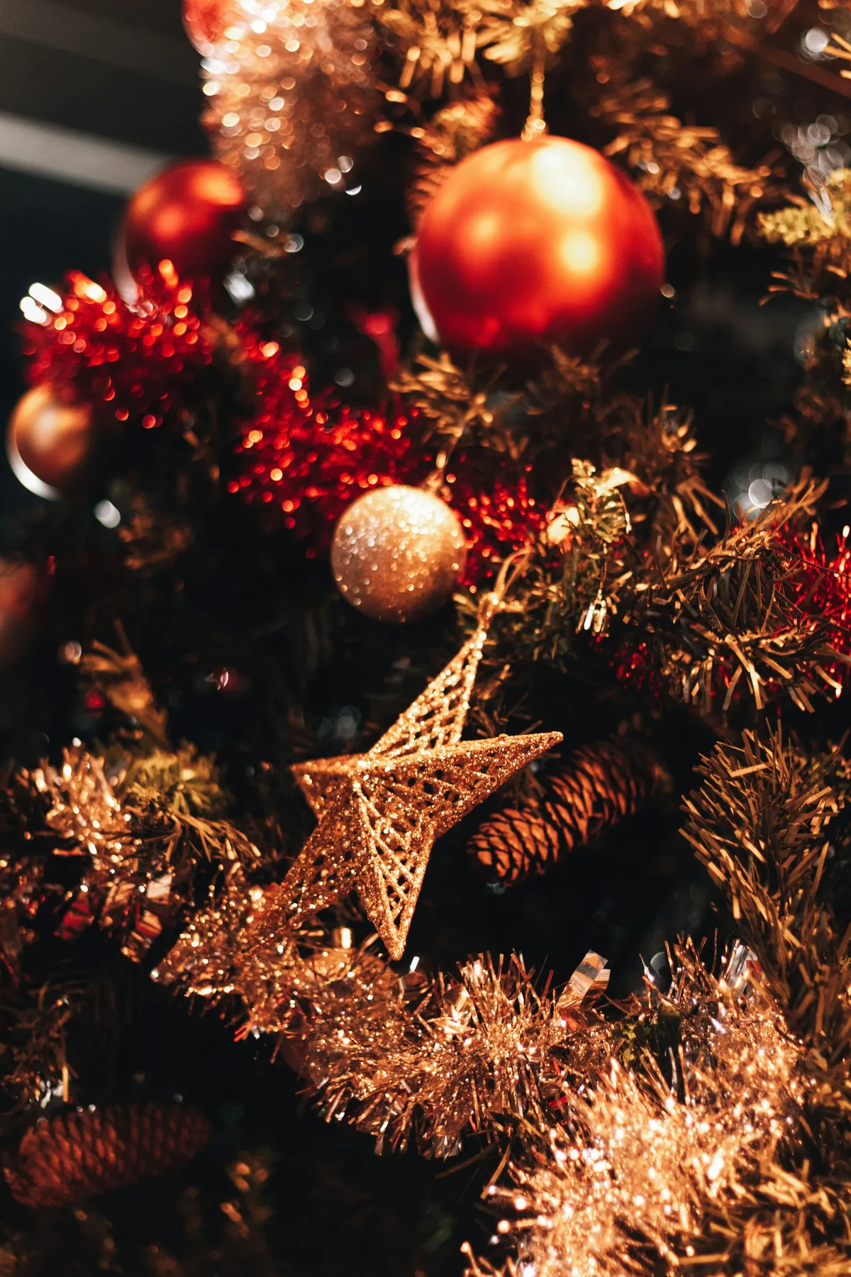 a close up of a christmas tree with ornaments