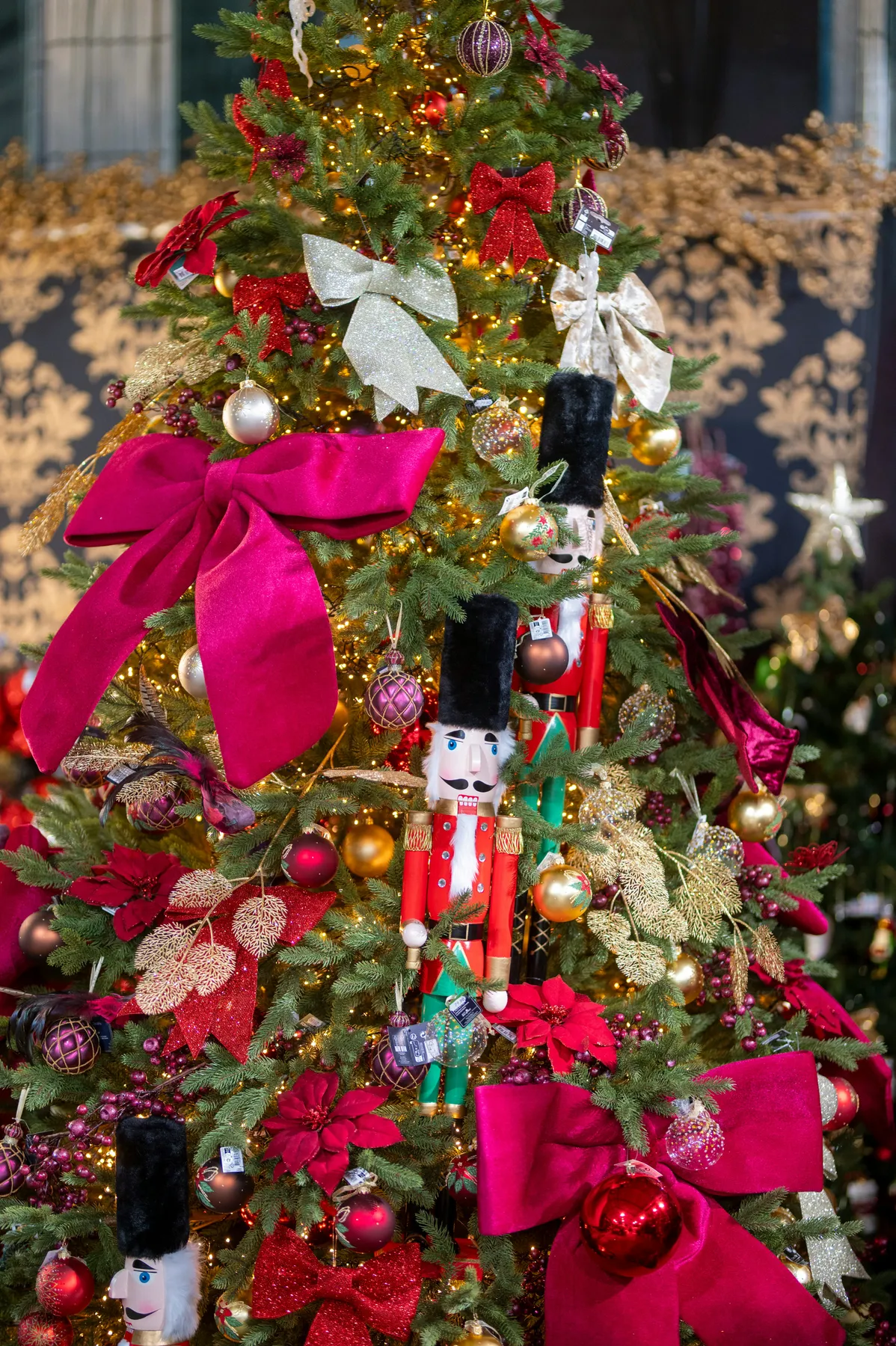 A decorated christmas tree with nutcracker ornaments