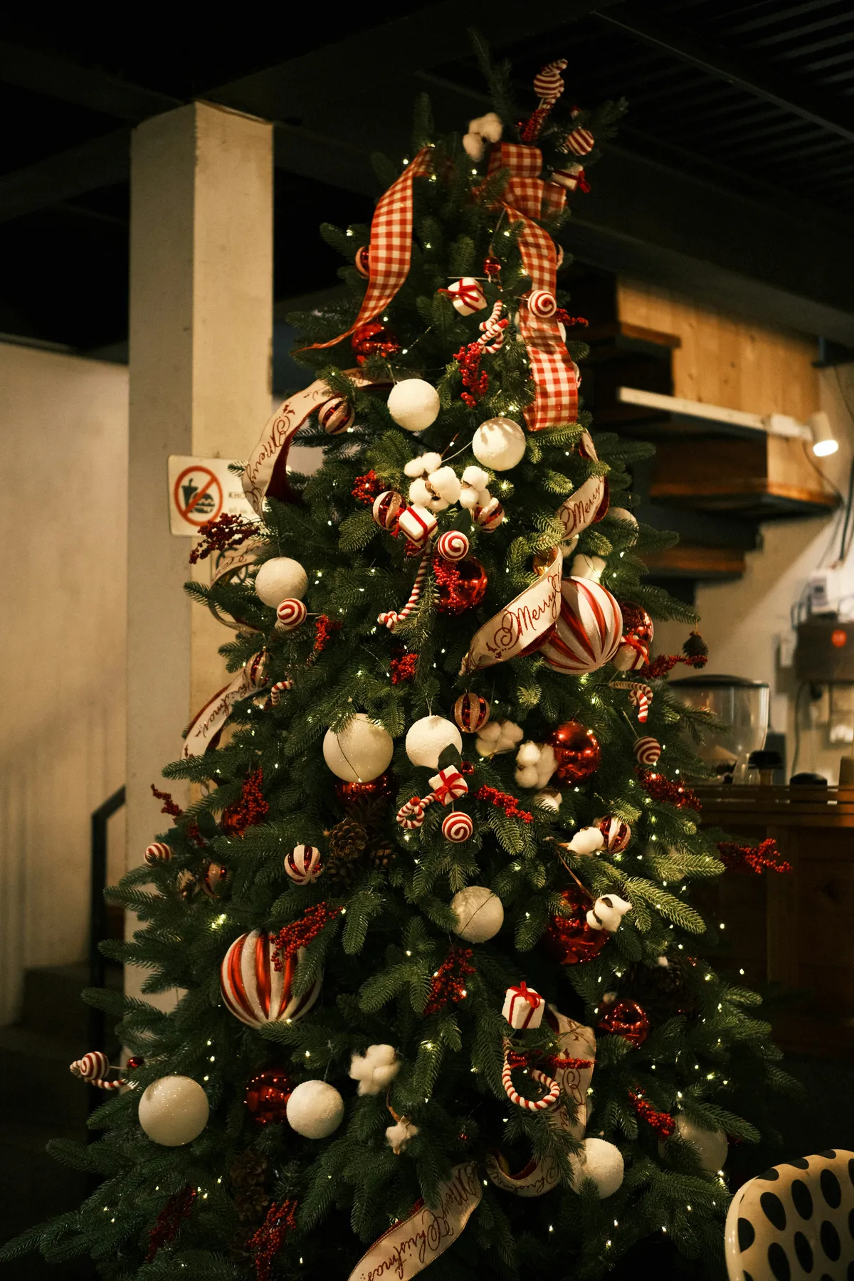 A decorated christmas tree with red and white ornaments