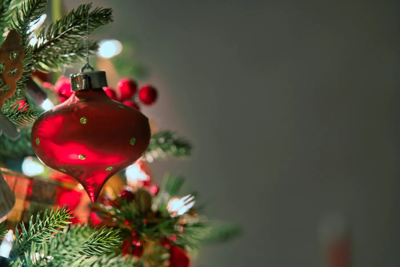 A macro shot of a red Christmas ornament