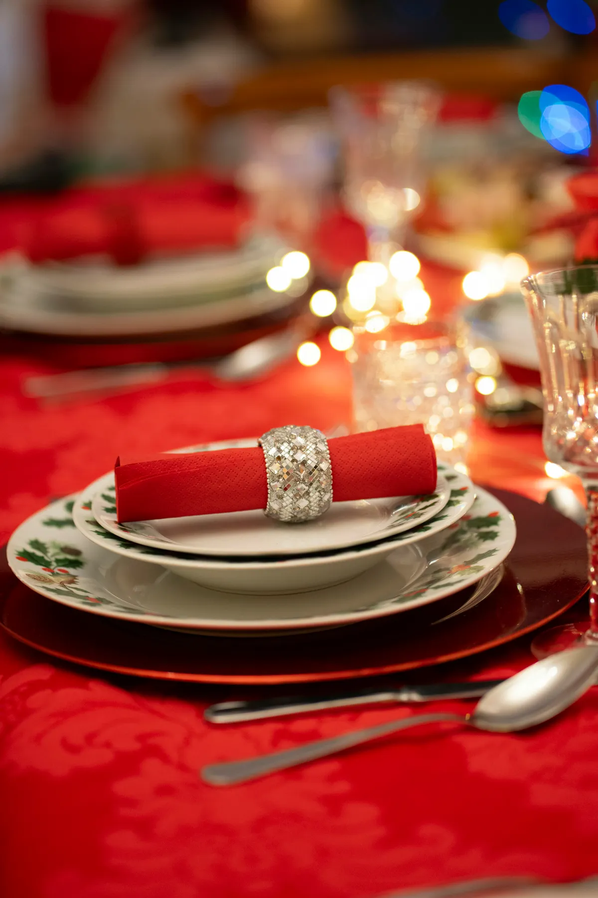 A table set for a formal dinner with a red table cloth - Free Photo on  Unsplash