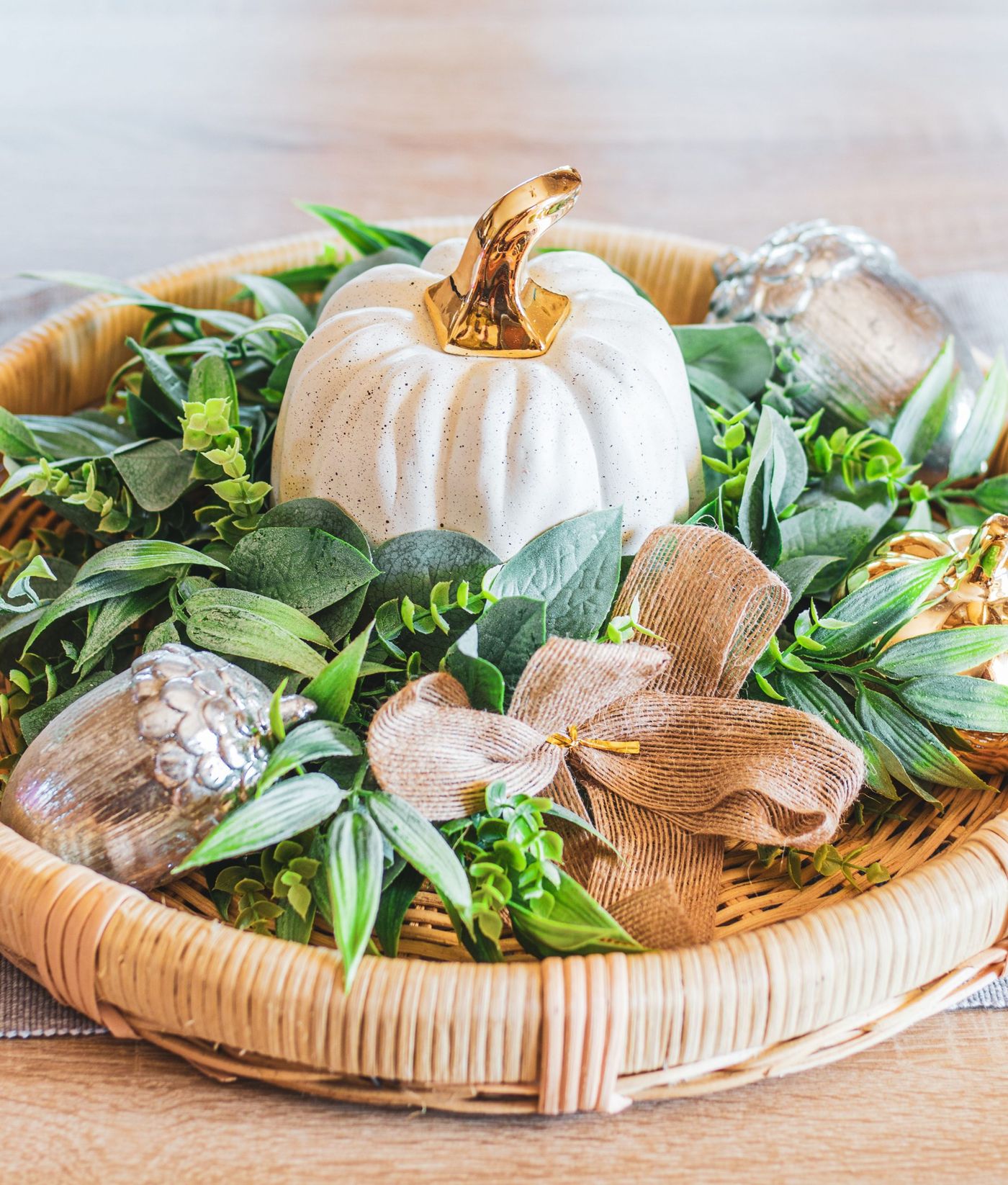 Autumn-themed tray featuring a decorative pumpkin, greenery, and metallic accents for a cozy seasonal touch.