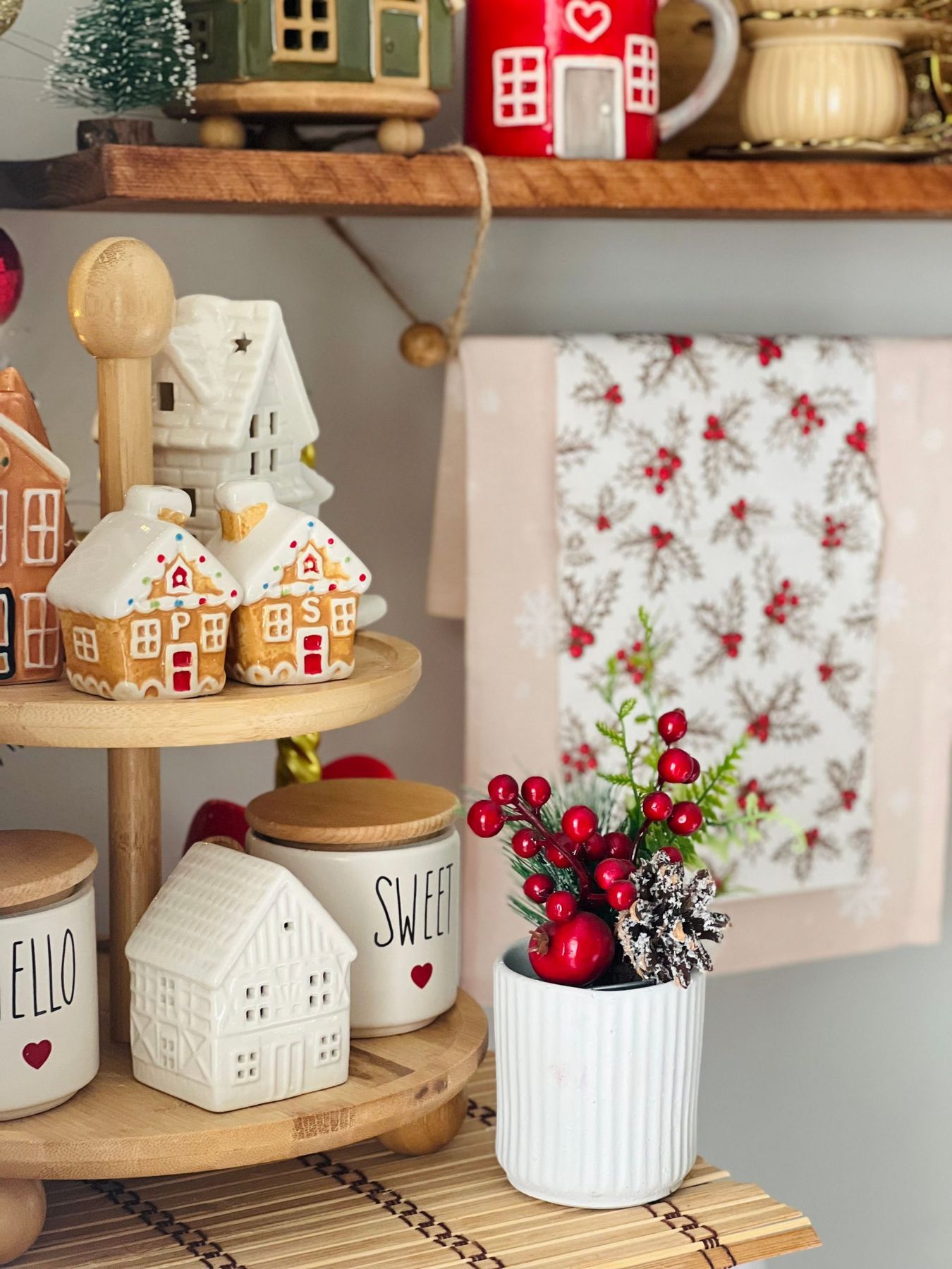 Charming holiday decor featuring gingerbread houses and festive ceramics.