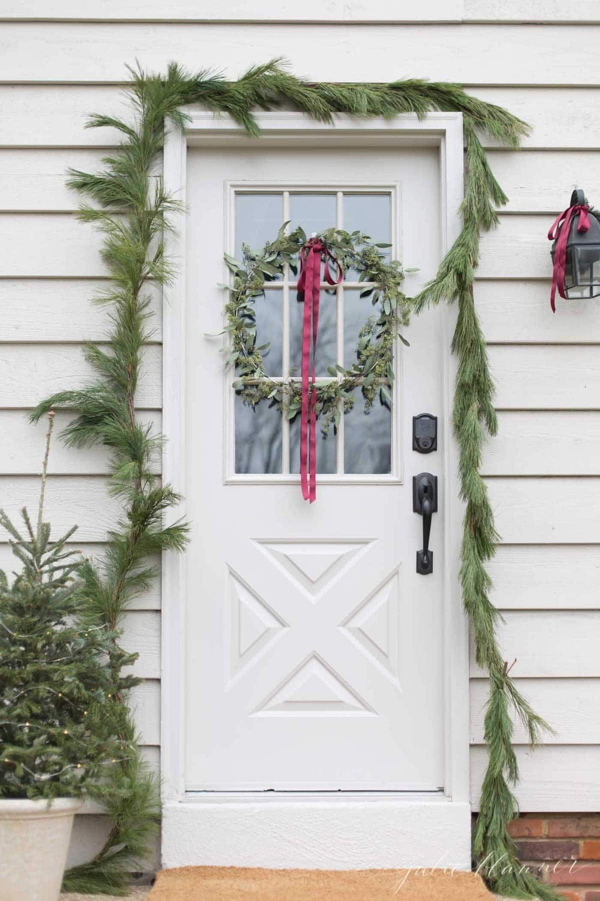 Christmas Door Decorations with Wreaths and Garlands | Julie Blanner