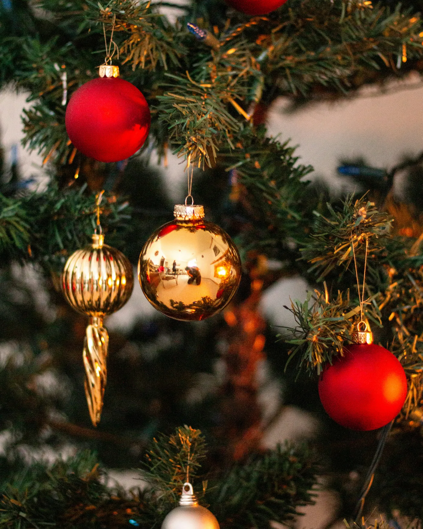 christmas ornaments hanging from tree looking festive