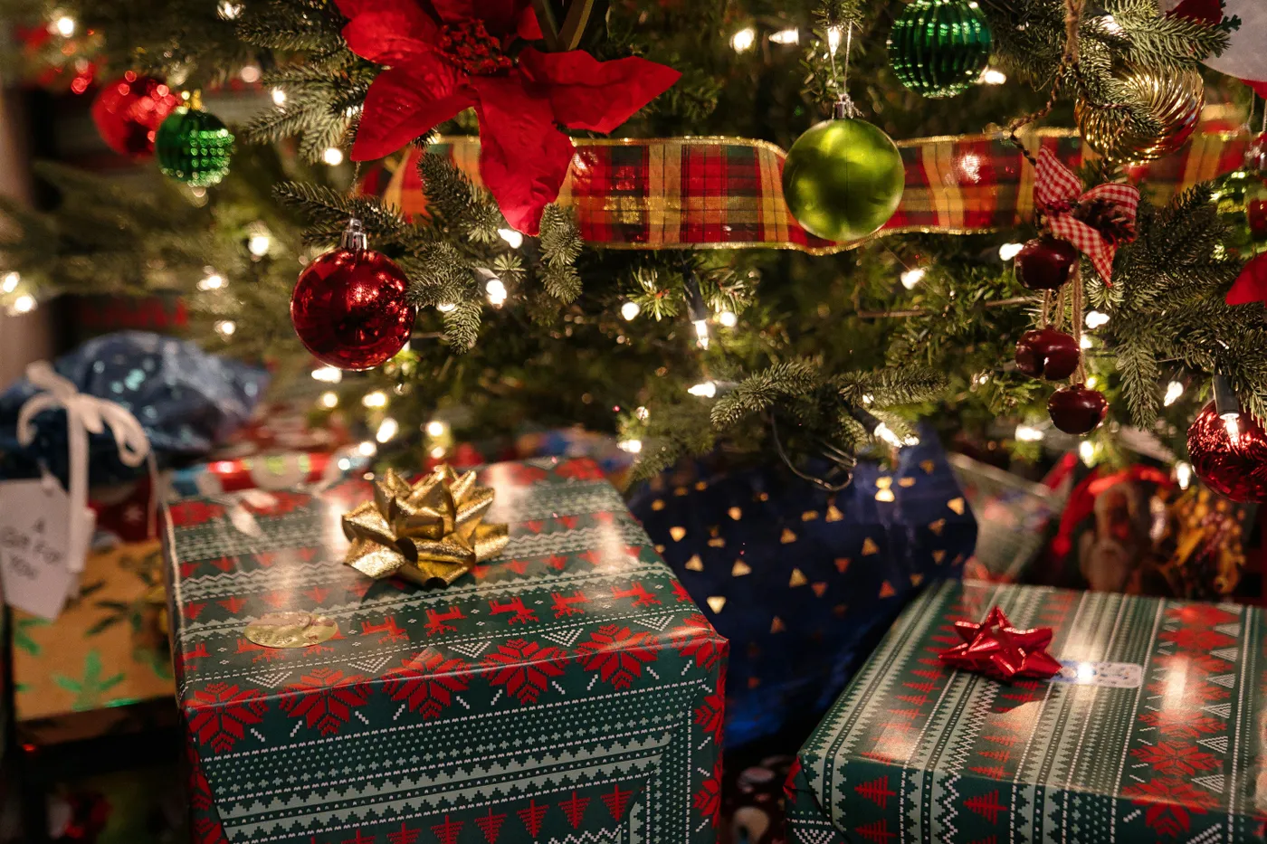 Christmas presents waiting to be opened underneath the Christmas tree