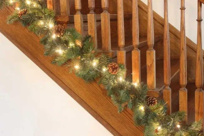 Easy and Inexpensive Christmas Stair Garland - Momcrieff