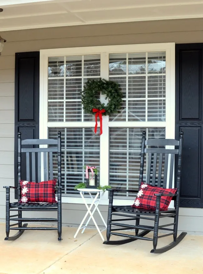 Farmhouse style Christmas front porch with picket fences