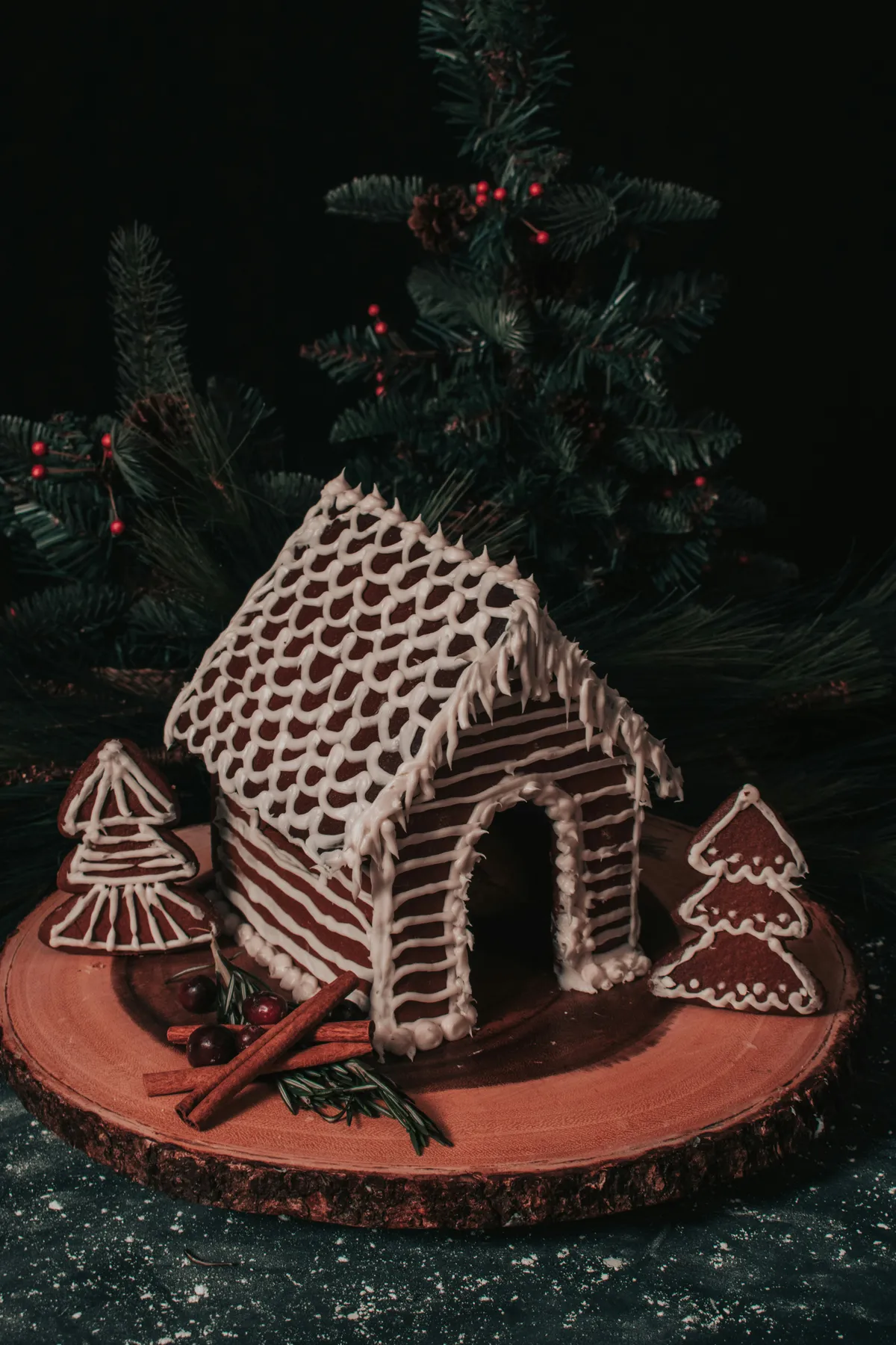 gingerbread house, trees, frosting, cinnamon sticks, cranberries, rosemary, evergreen trees, wood tray