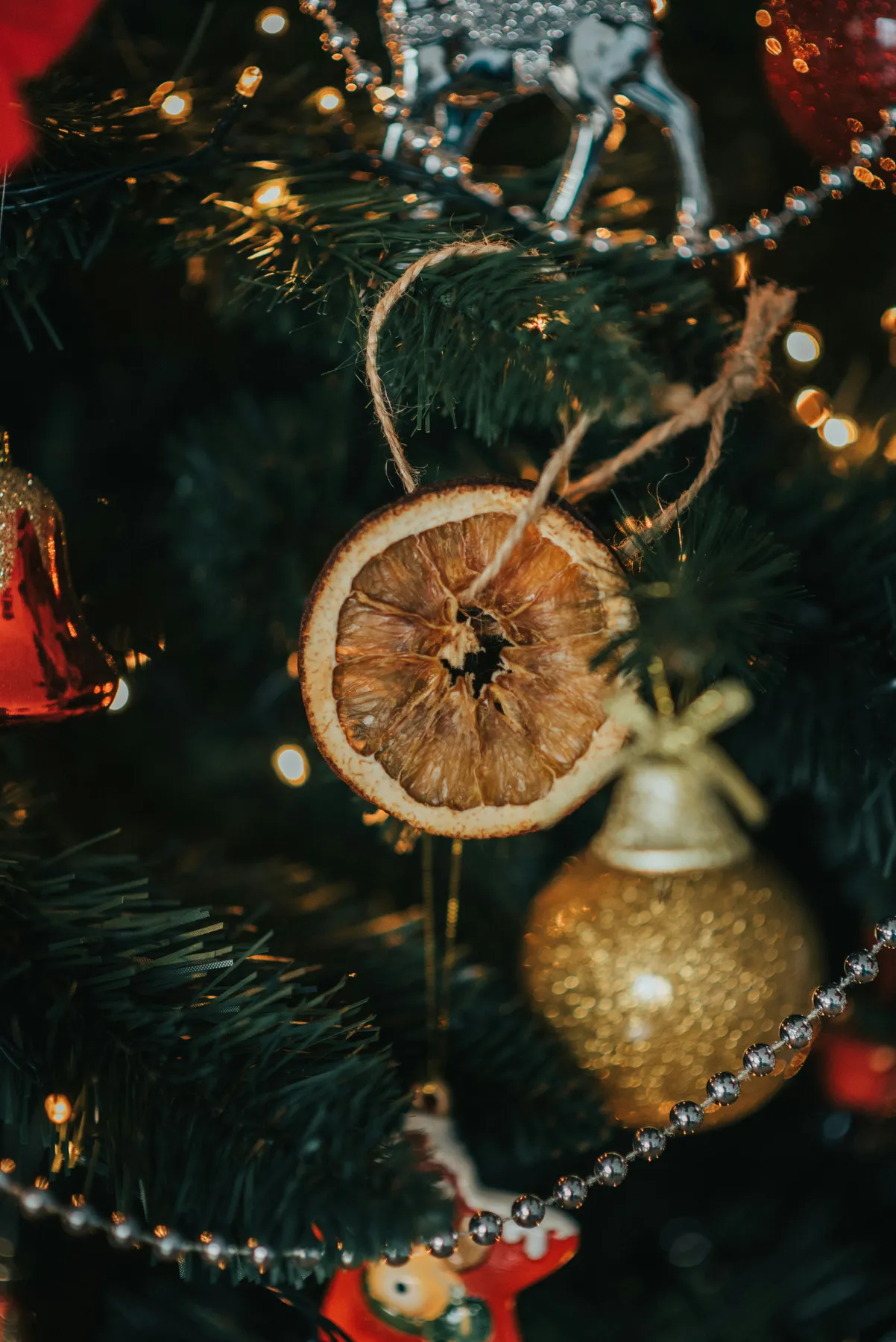 gold and red baubles on green christmas tree