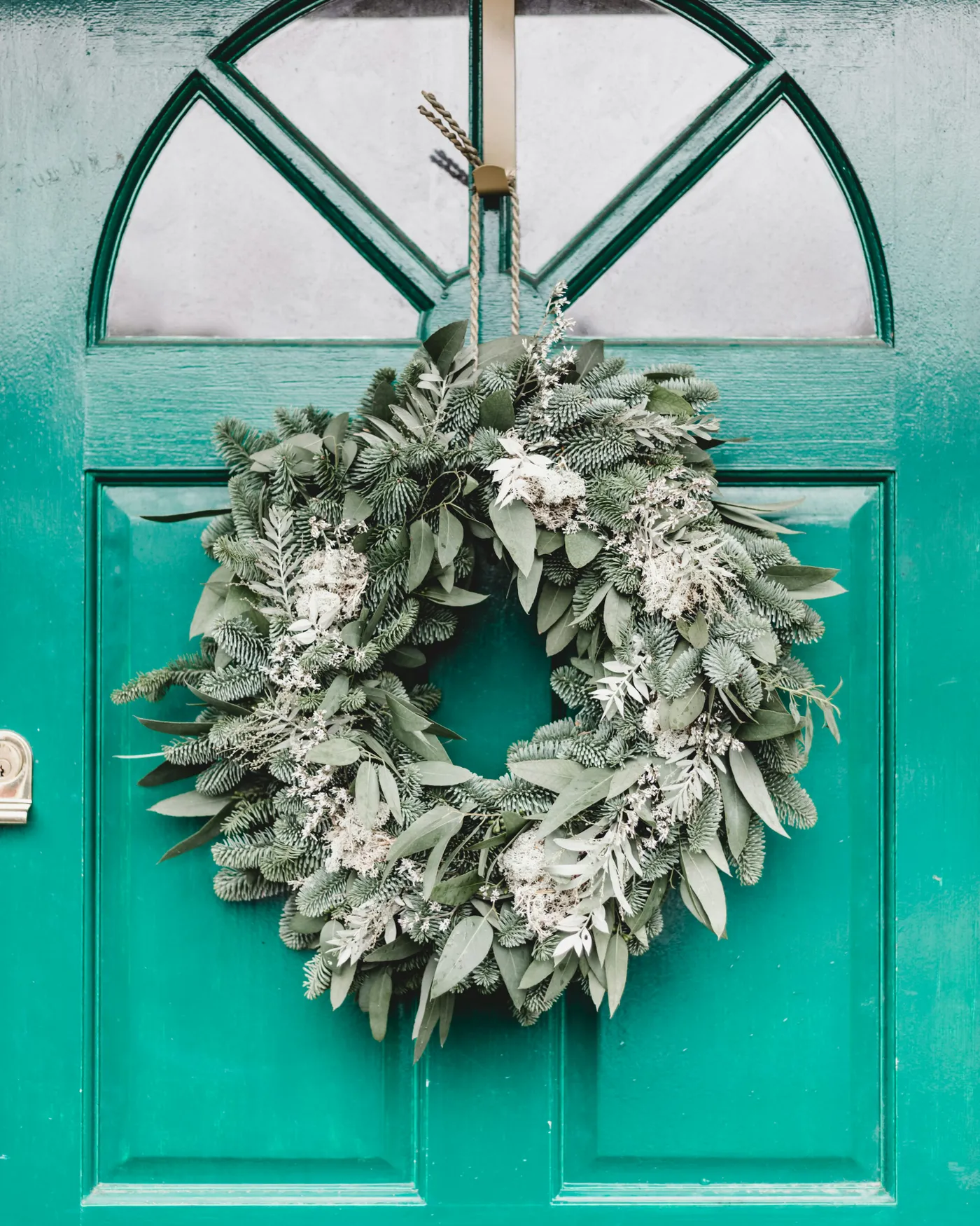 Green leafy wreath hanging on door - Free Photo on Unsplash