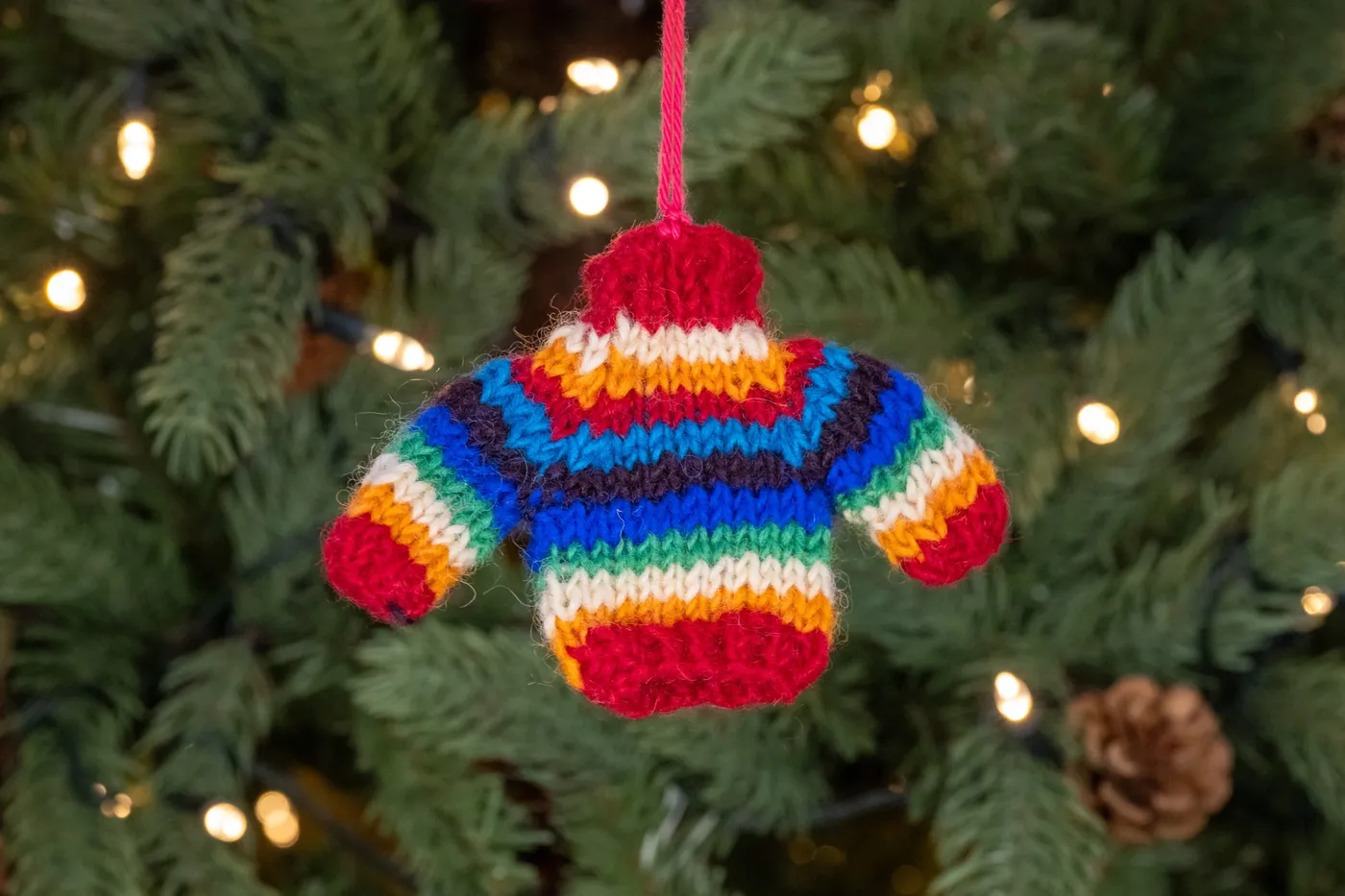 Hand Knitted Rainbow Jumper Tree Decoration | Save the Children Shop