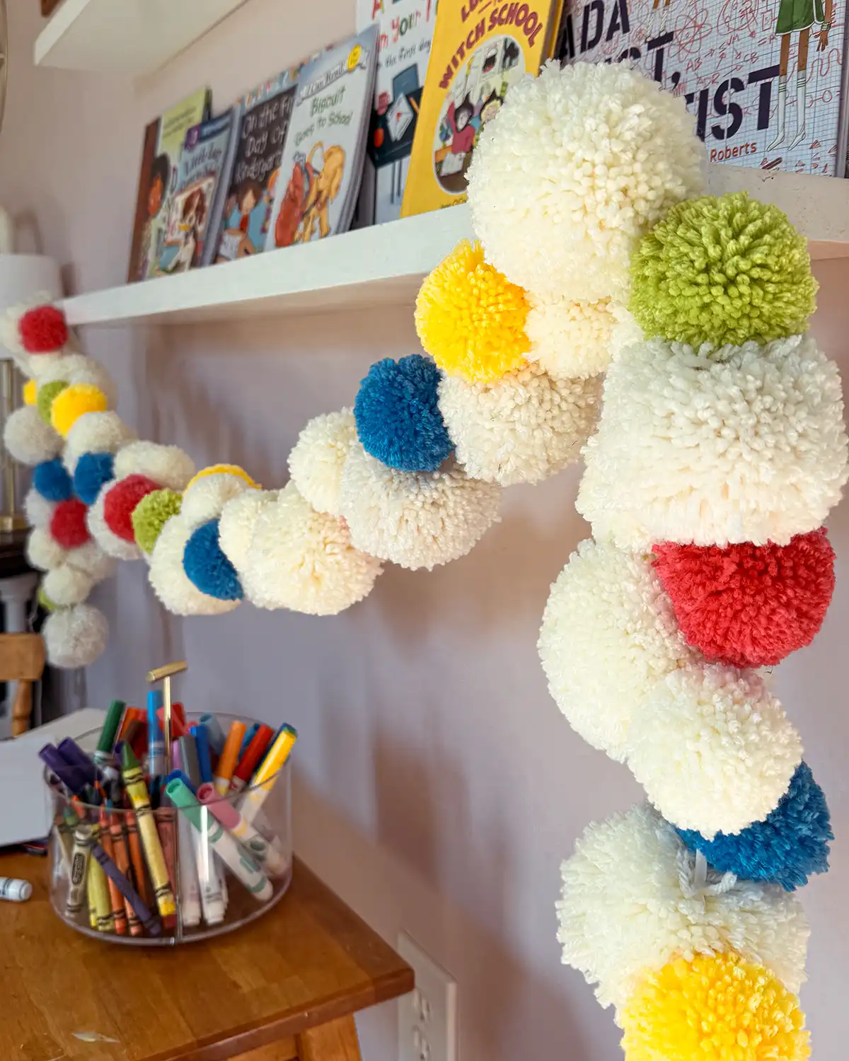 Make The Fluffiest DIY Pom Pom Garland From Yarn