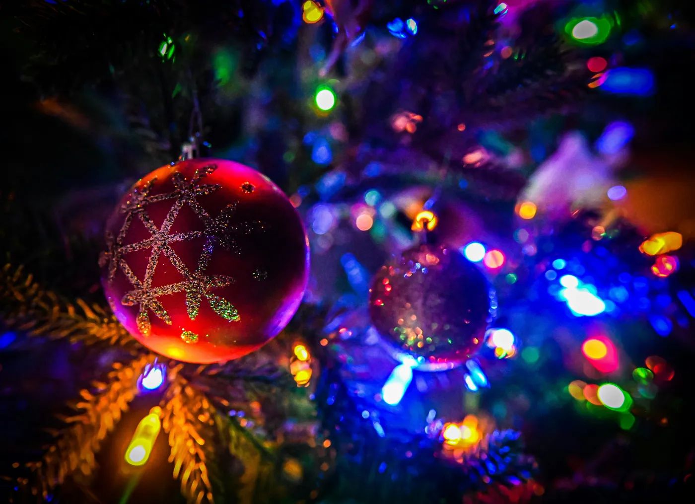 Ornaments and Christmas lights hanging on a tree