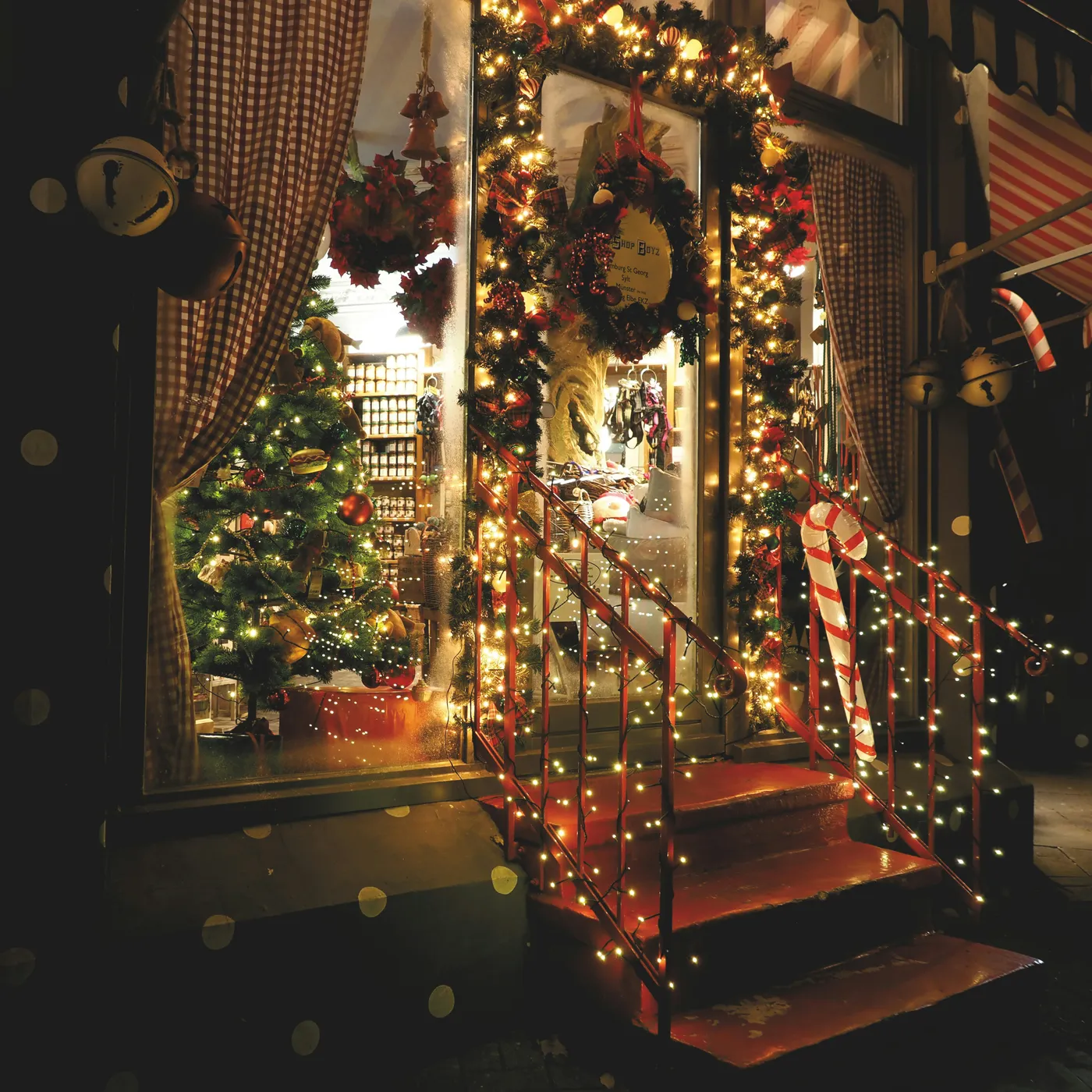 people walking on stairs with lighted string lights