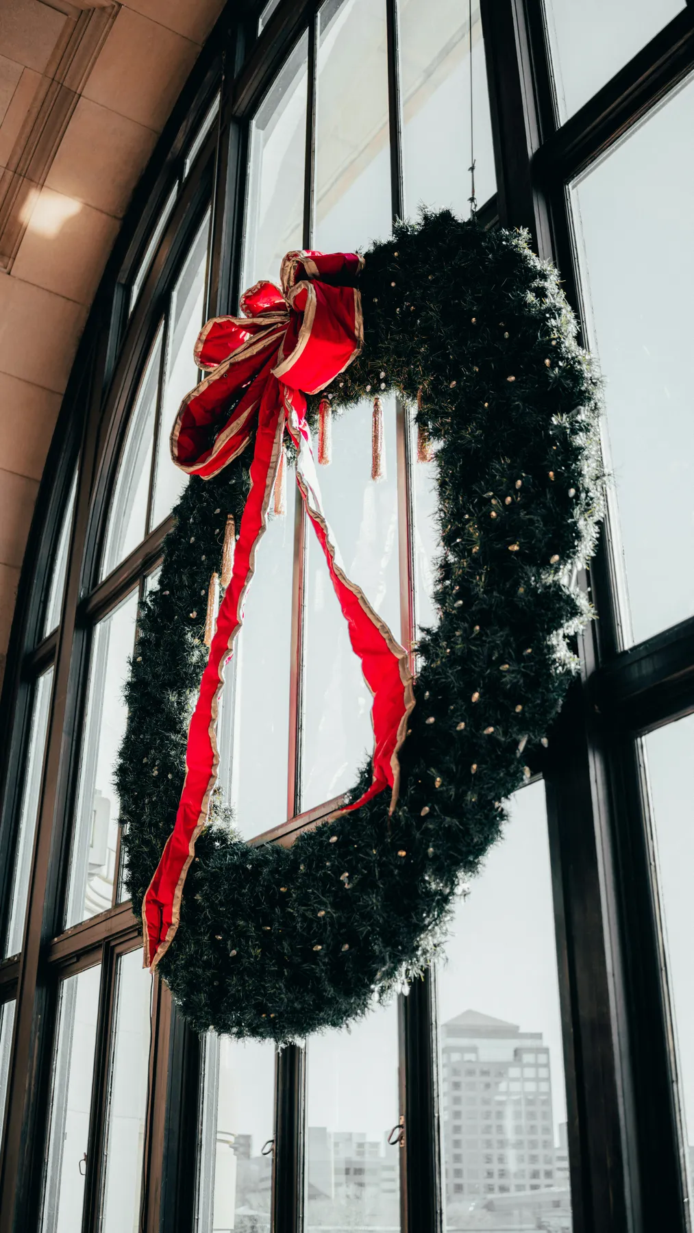 Red and white ribbon on black metal window - Free Photo on Unsplash